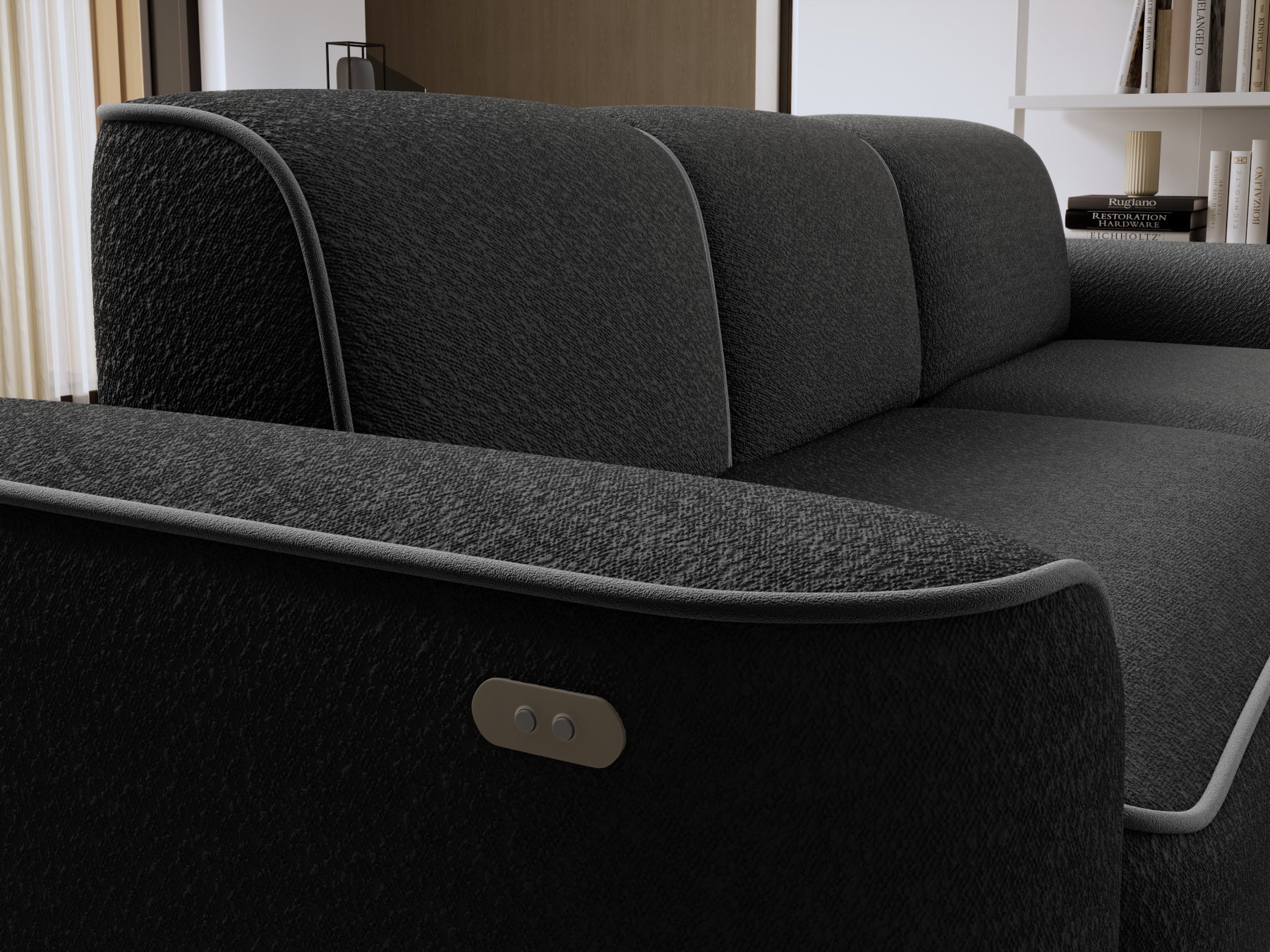 Zbliżenie na oparcie i boczny panel narożnika Ume, fakturowana tkanina Royal 05 czarny z dyskretną lamówką Velvetmat 04 szary.