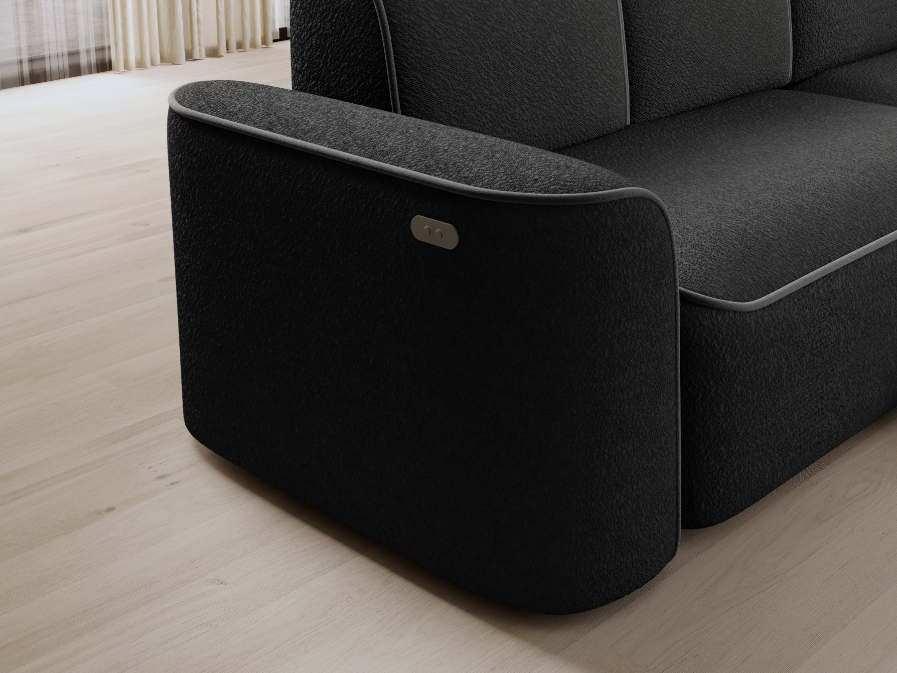 Detal podłokietnika narożnika Ume z przyciskiem sterowania, tapicerka bouclé Royal 05 czarny i lamówka Velvetmat 04 szary.