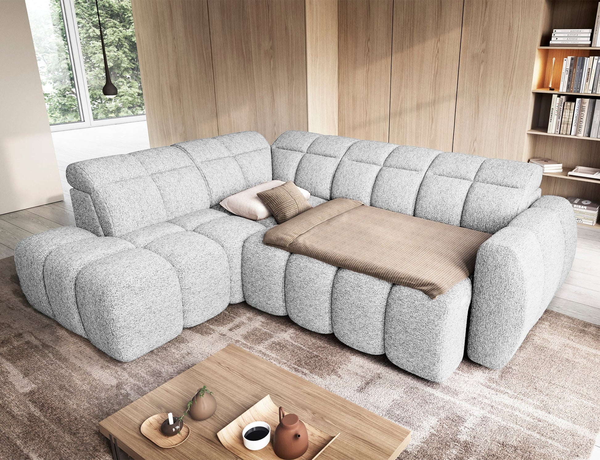 Narożnik Falconn lewostronny Coralline 01 z rozłożoną funkcją spania, przykryty kocem i poduszkami, w nowoczesnym salonie.