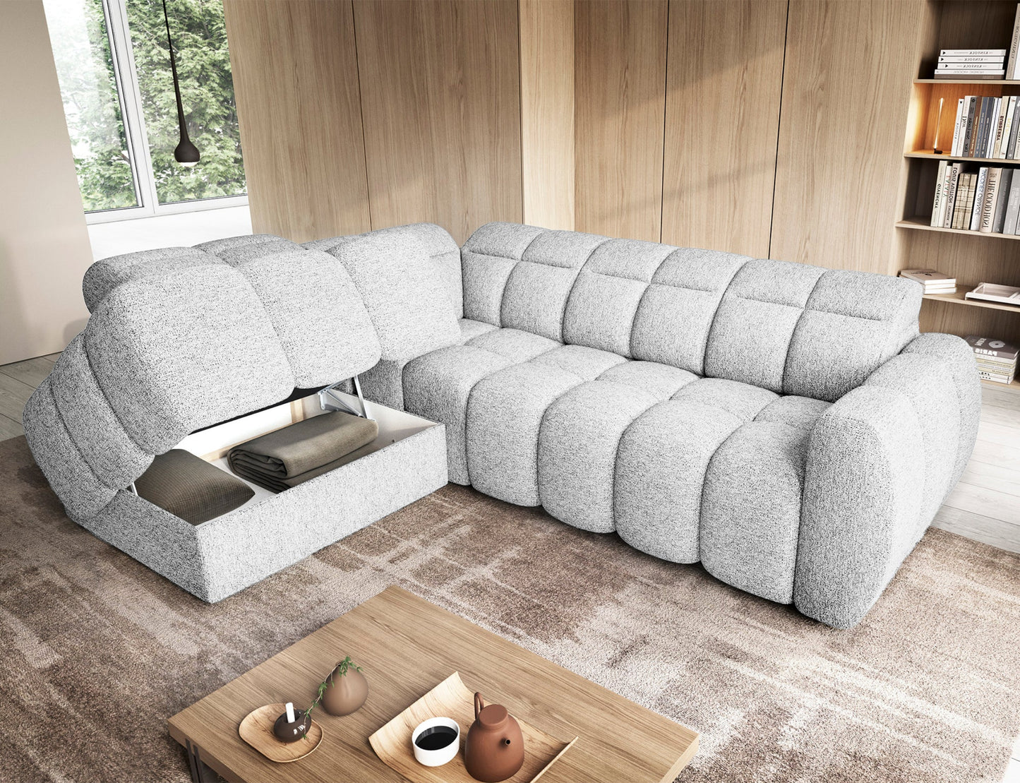 Narożnik Falconn lewostronny Coralline 01 z otwartym pojemnikiem na pościel, pokazującym schowek z kocami w jasnym salonie.