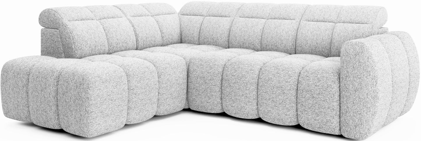 Nowoczesny narożnik Falconn lewostronny w tkaninie Coralline 01, z miękkim pikowanym wykończeniem i zaokrągloną formą.