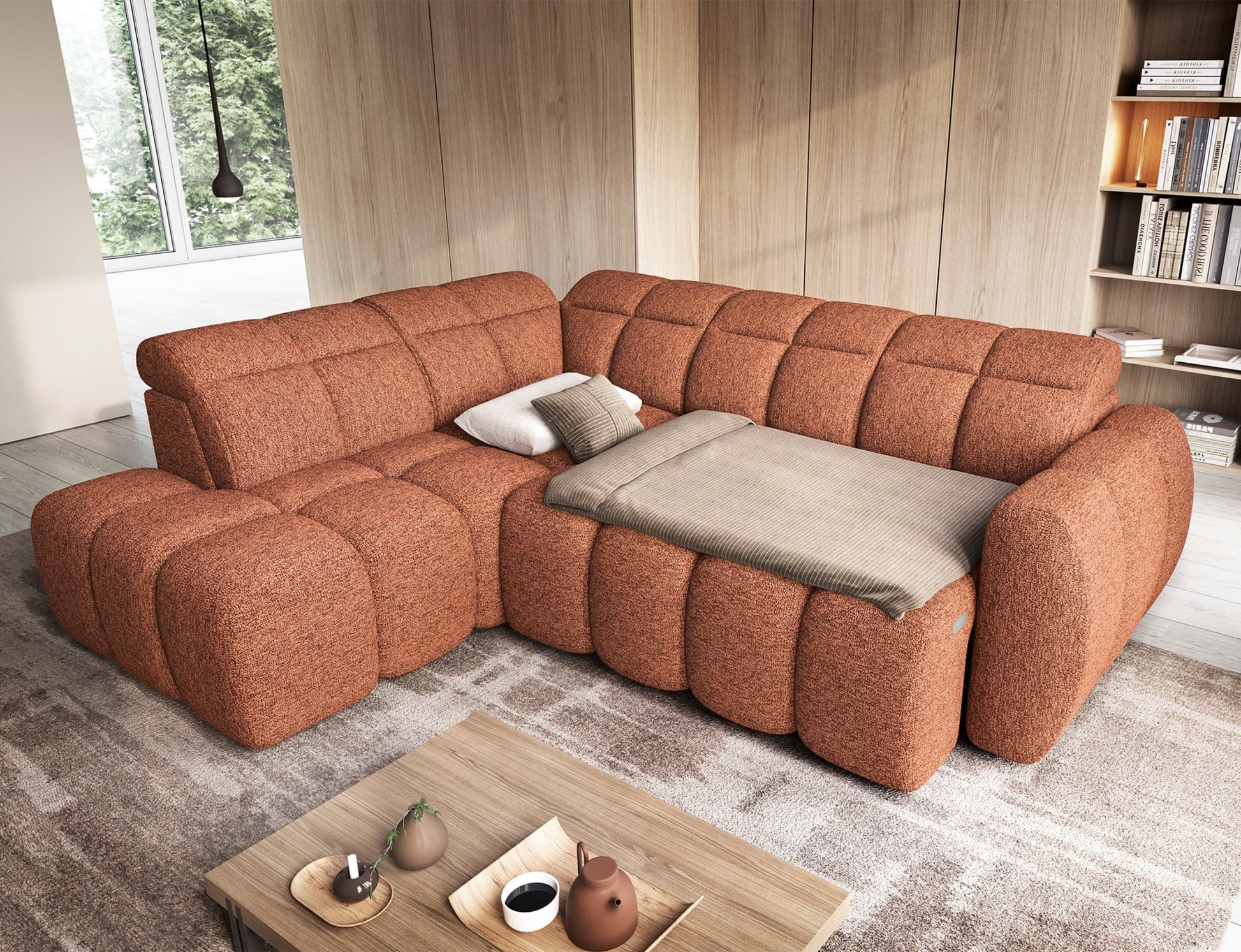 Narożnik Falconn w kolorze ceglastym, tkanina Coralline 30 – rozłożona funkcja spania z pościelą, widok w aranżacji salonu.