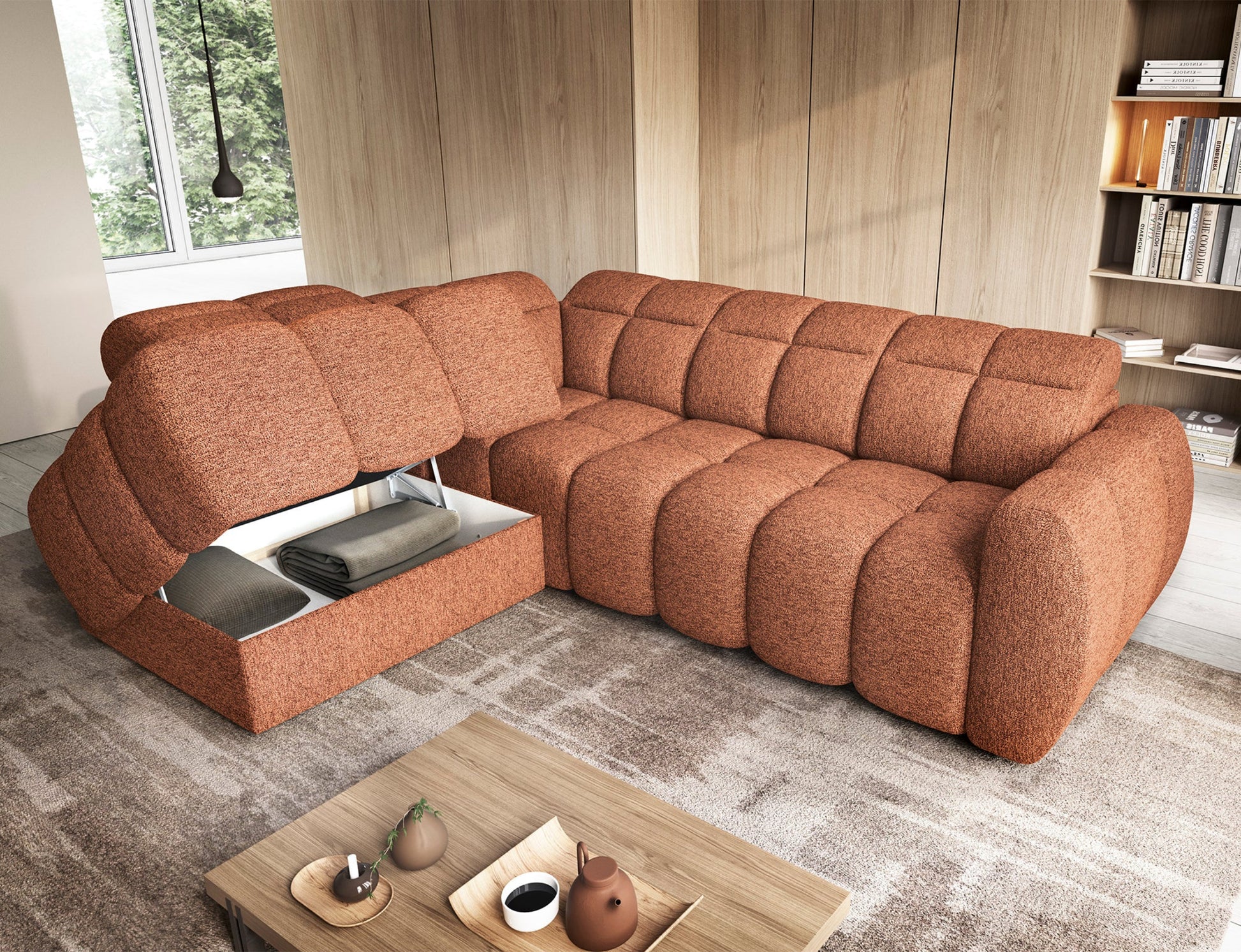 Narożnik Falconn w tkaninie Coralline 30, ceglasty, z otwartym pojemnikiem na pościel, ukazany w nowoczesnym, jasnym wnętrzu.