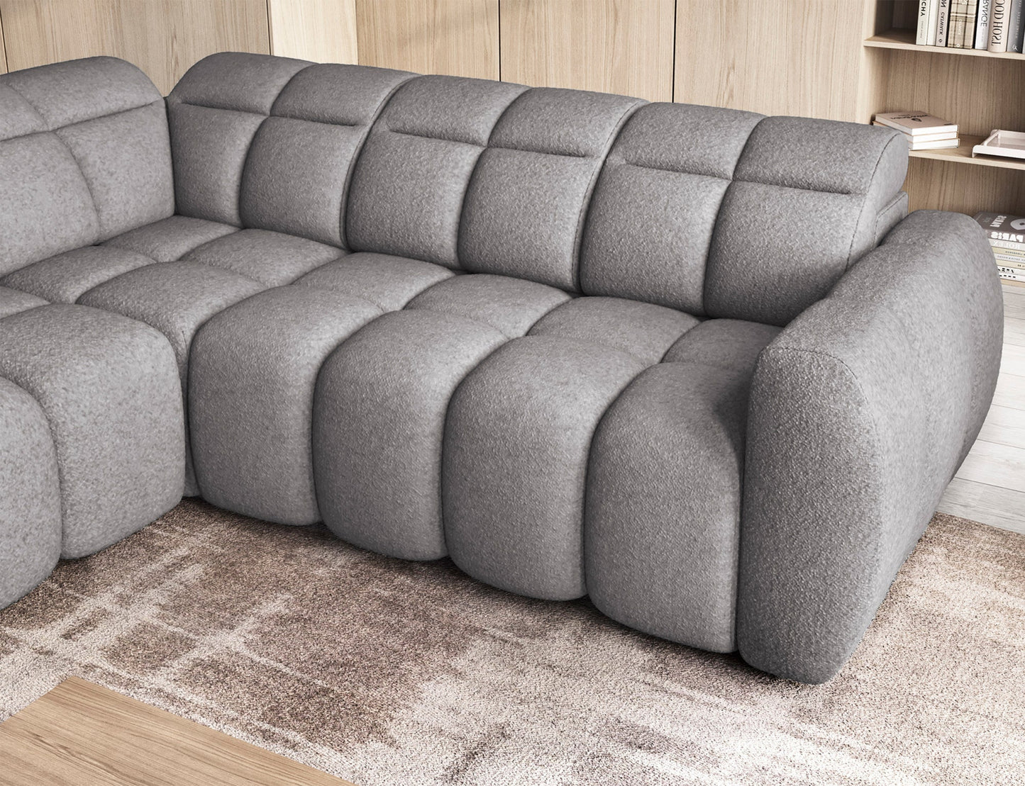 Narożnik Falconn Paolli 04 jasnoszary zbliżenie na siedzisko i podłokietnik, pikowana powierzchnia, nowoczesny design, przytulne wnętrze.