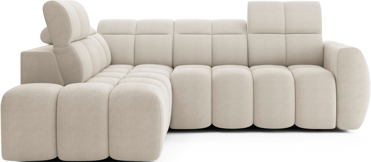 Beżowy narożnik Falconn Royal 18 na białym tle, z widocznymi segmentami i podnoszonym zagłówkiem, nowoczesny design i miękka tapicerka.