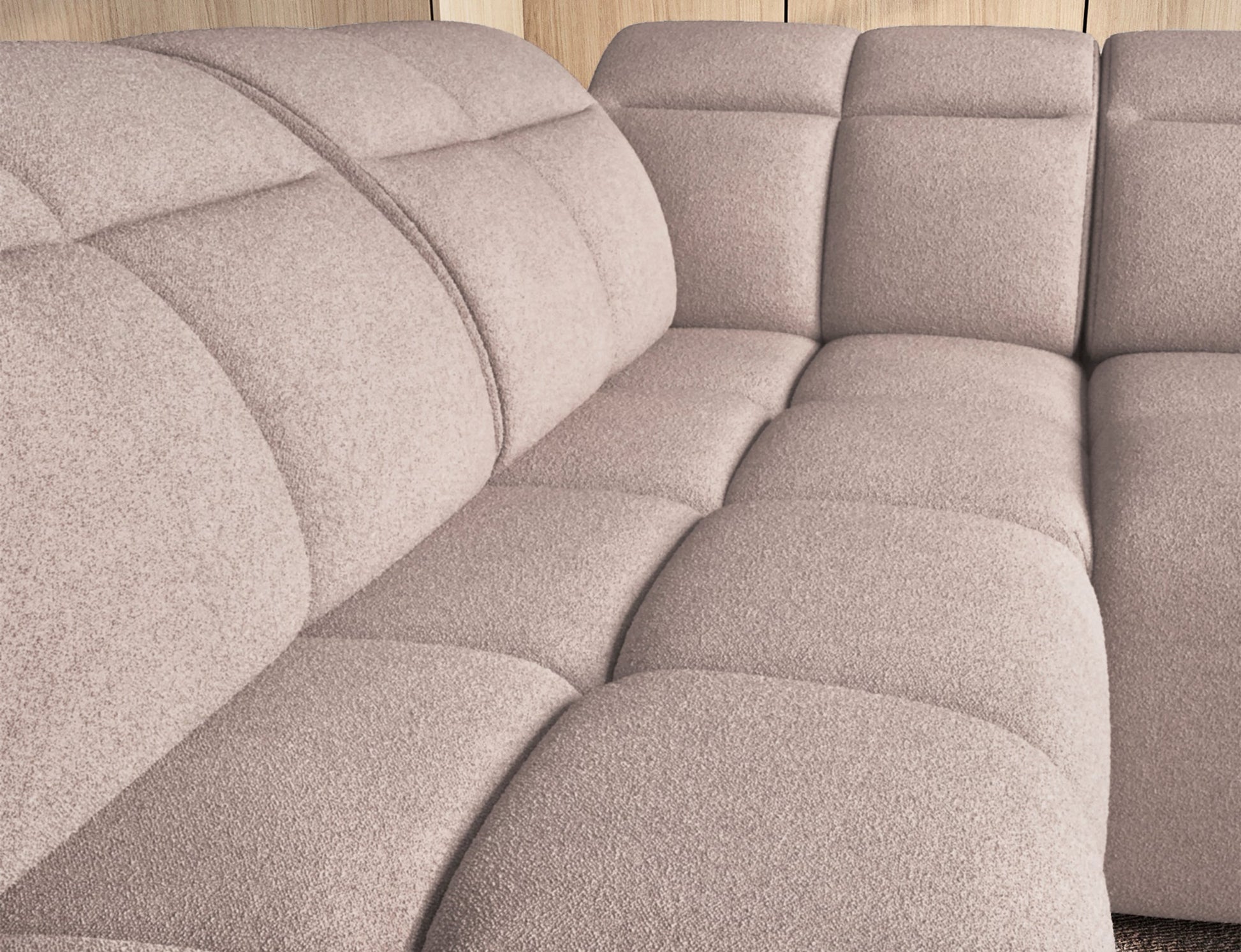 Ciemnobeżowy narożnik Falconn Xillar 20 zbliżenie na pikowane, miękkie siedzisko oraz oparcie, widoczne nowoczesne przeszycia tkaniny.