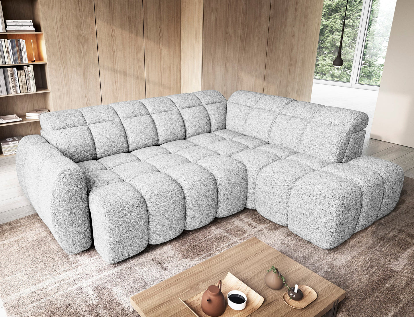 Narożnik Falconn Coralline 01 w białej tkaninie, widok z góry w aranżacji salonowej, rozłożona funkcja spania, poduszki dekoracyjne na siedzisku.