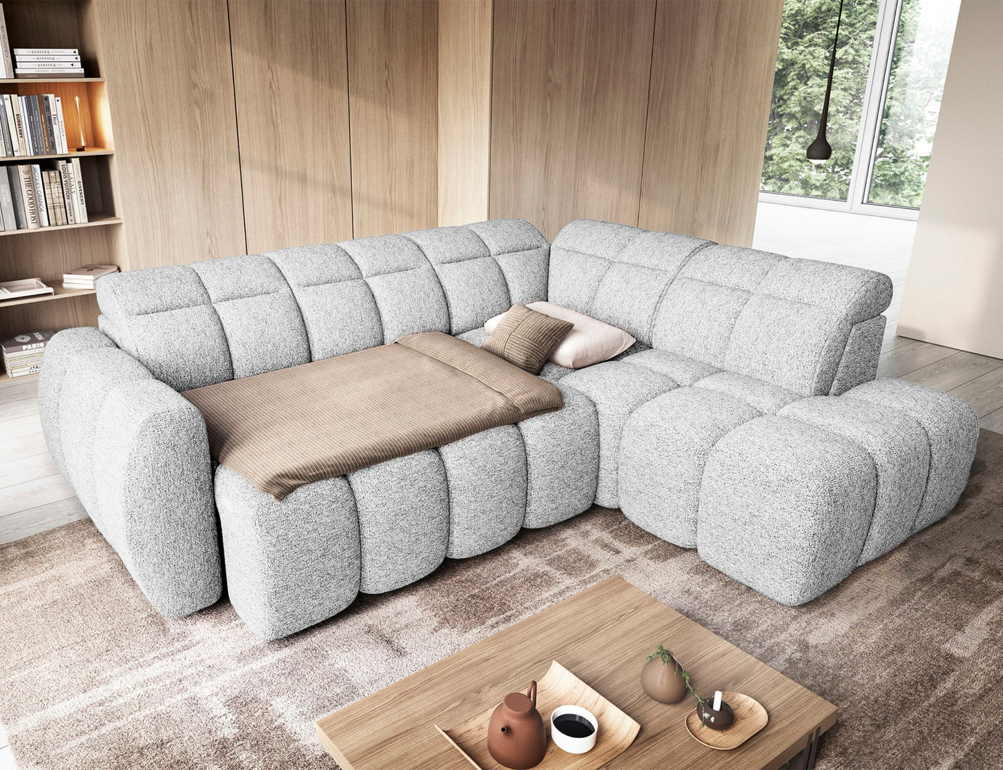 Narożnik Falconn Coralline 01 w białej tkaninie, widok z góry w aranżacji salonowej, rozłożona funkcja spania z poduszkami dekoracyjnymi i narzutą.