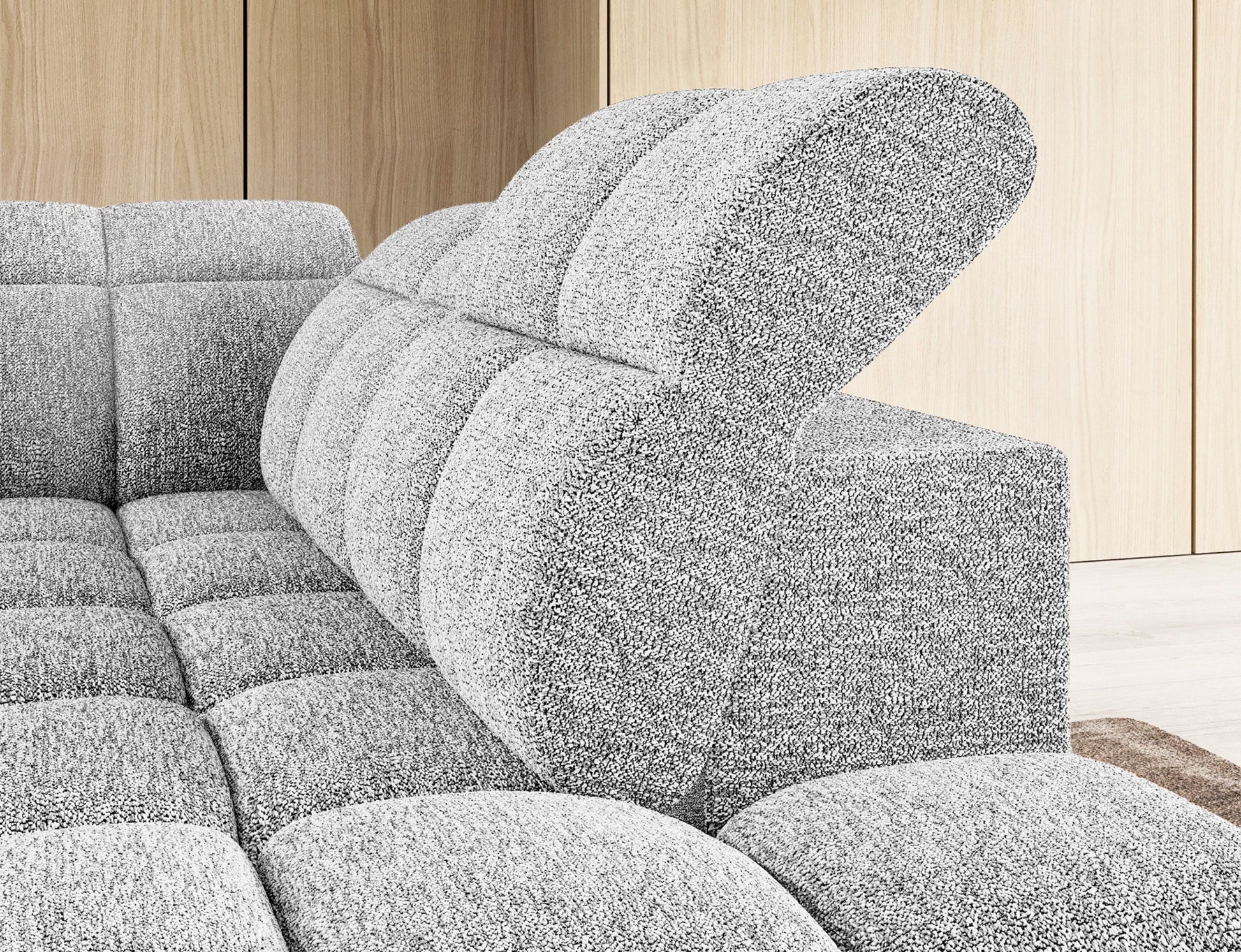 Narożnik Falconn Coralline 01 w kolorze białym — szczegółowy widok regulowanego zagłówka i tylnej części oparcia.