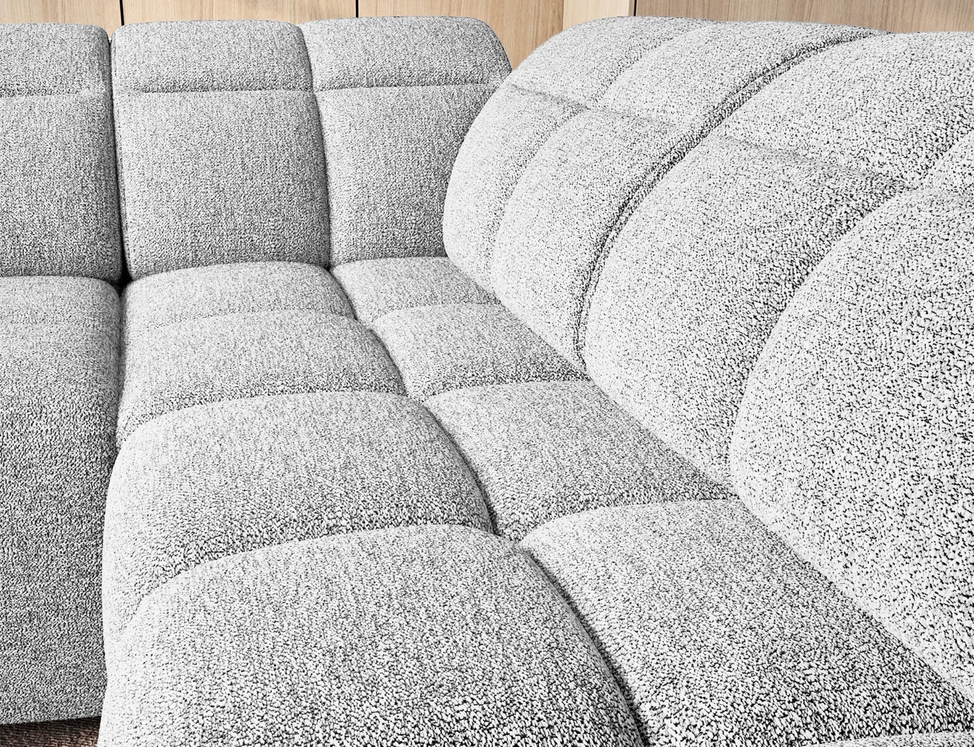 Narożnik Falconn Coralline 01 w kolorze białym — szczegółowy widok siedziska z wyraźnie widoczną fakturą tkaniny i wyprofilowaniem oparcia.