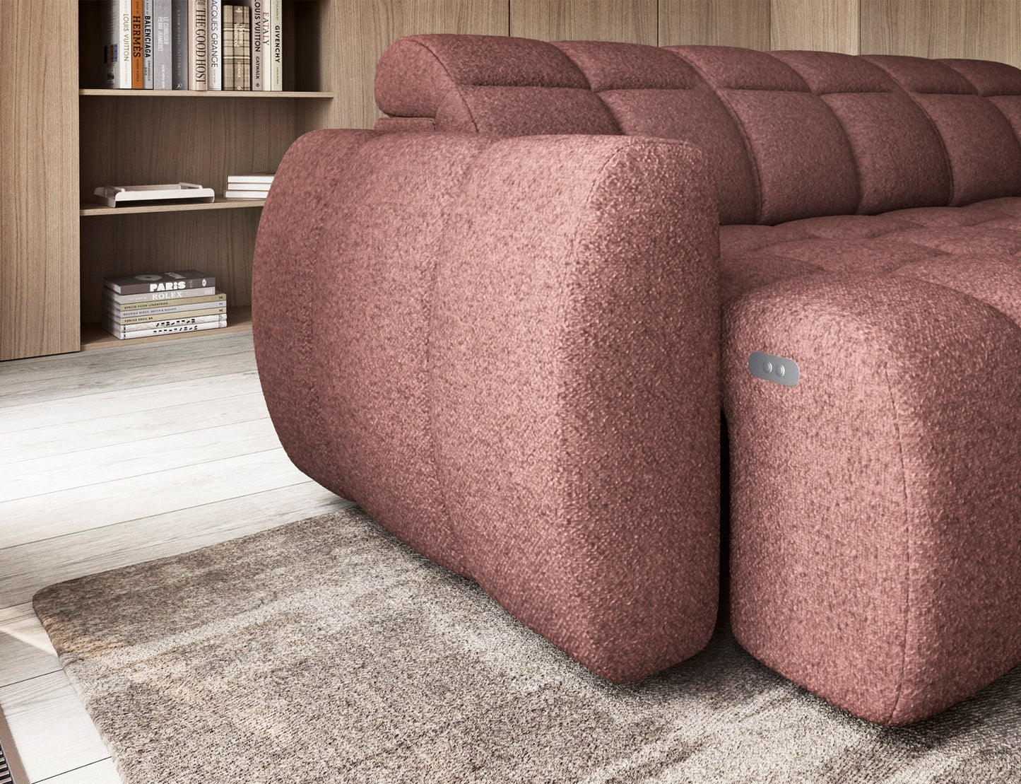 Zbliżenie na boczek narożnika Falconn Paolli 24 w tkaninie różowej, z widocznym przyciskiem sterującym i miękkim profilowanym kształtem.