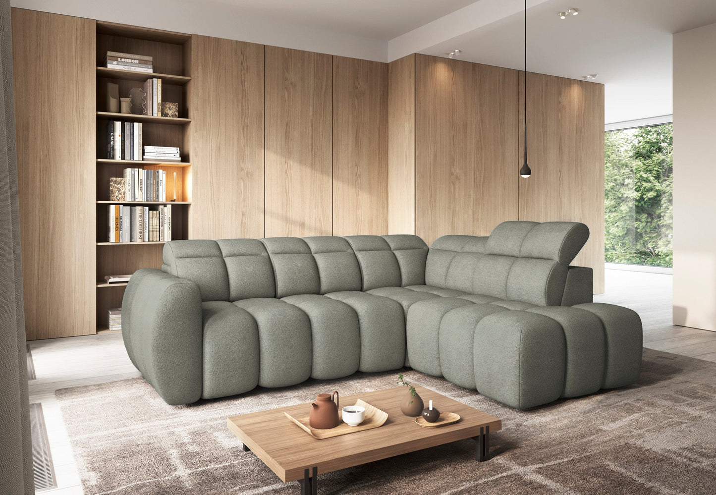 Narożnik Xillar 100 jasnozielony w nowoczesnym salonie, z pikowanymi siedziskami i regulowanym zagłówkiem, ustawiony na dywanie.