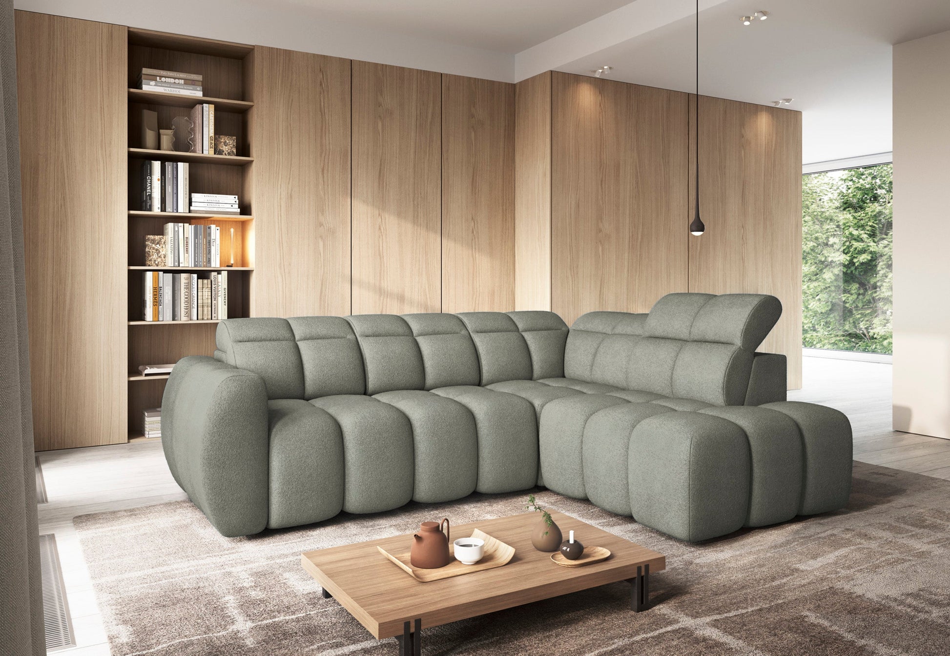 Narożnik Xillar 100 jasnozielony w nowoczesnym salonie, z pikowanymi siedziskami i regulowanym zagłówkiem, ustawiony na dywanie.