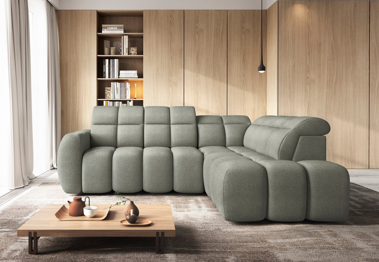 Narożnik Xillar 100 jasnozielony w nowoczesnym salonie, z miękką tapicerką, regulowanym zagłówkiem i zaokrąglonymi siedziskami.