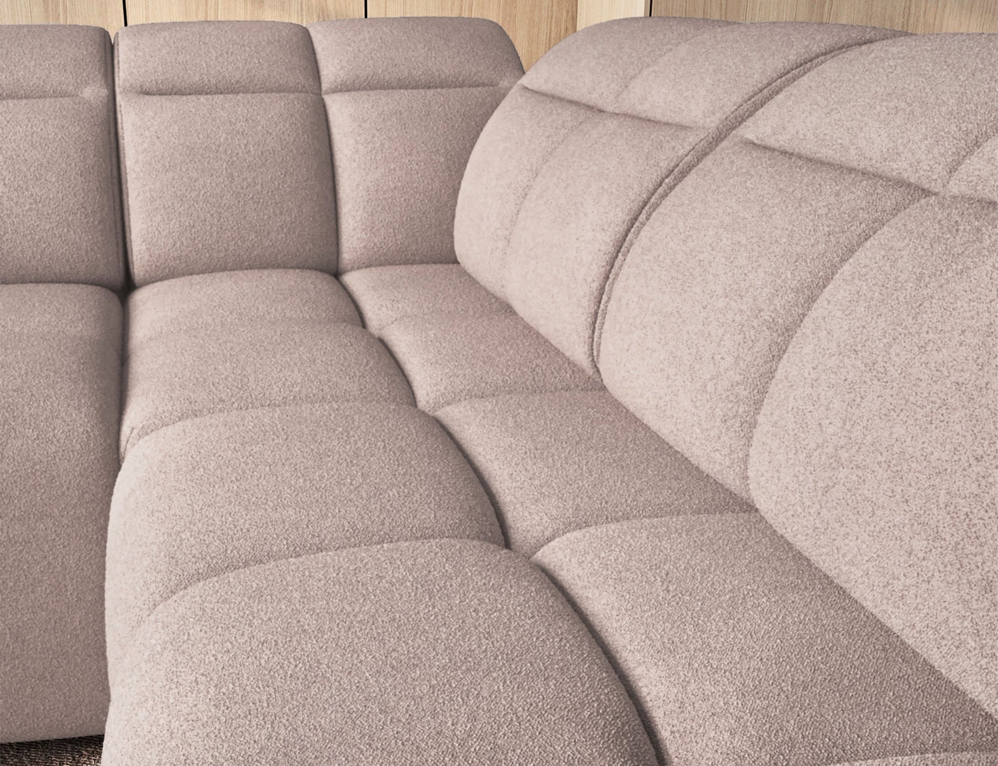 Zbliżenie na siedzisko i oparcia narożnika Xillar 20 w tkaninie ciemnobeżowej, prezentujące miękkie pikowania i komfortowe wyprofilowanie.