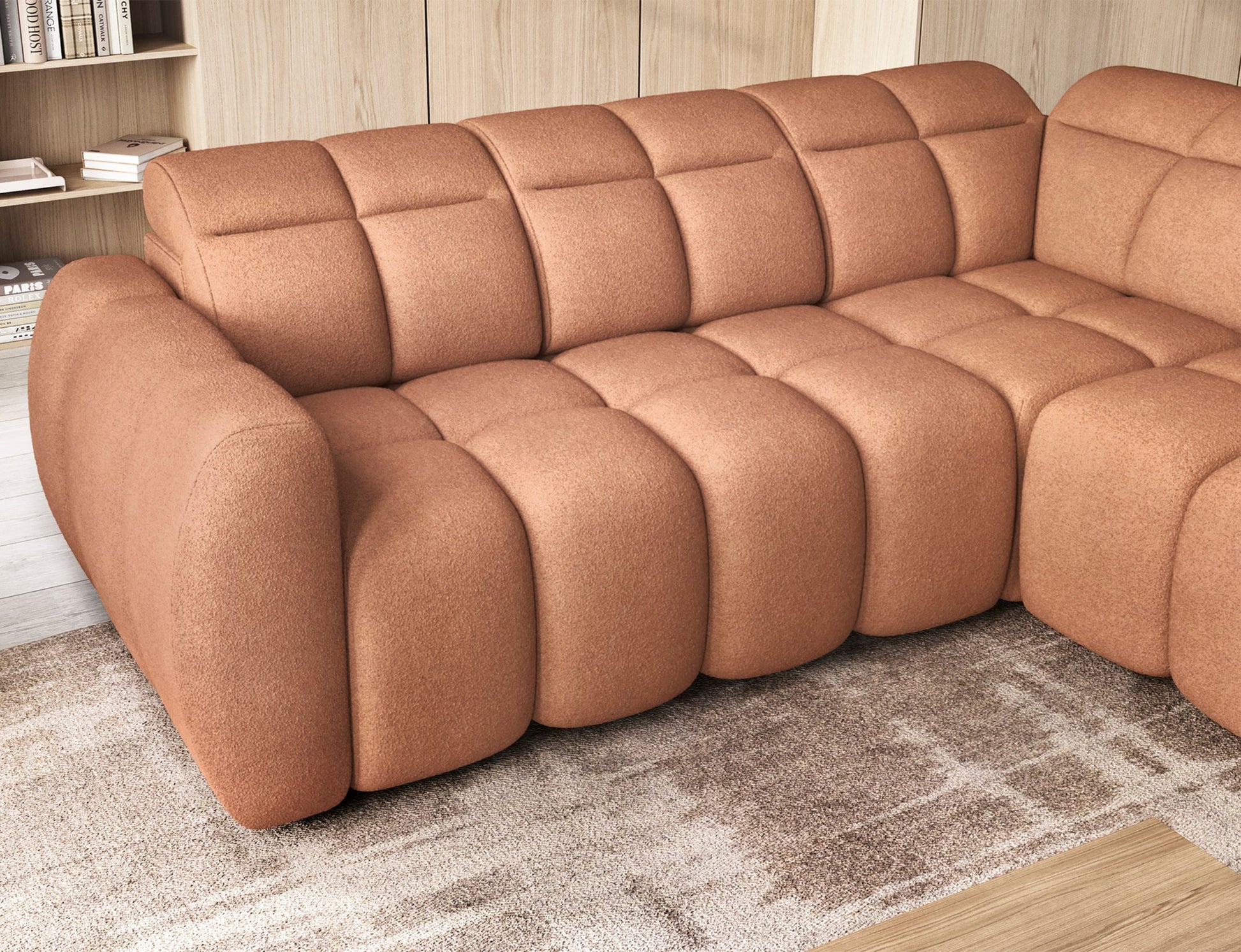 Zbliżenie na siedzisko narożnika Xillar 24 różowego z wsuniętymi segmentami, eksponujące miękkie przeszycia i tapicerkę o teksturze boucle.