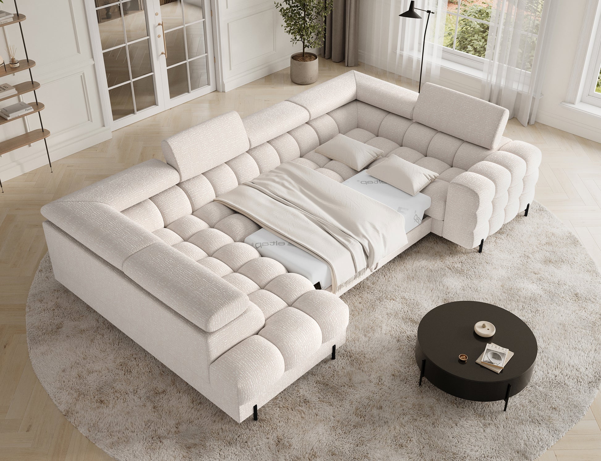 Narożnik Fectory Baffix 20 beżowy z rozłożoną funkcją spania – szeroka powierzchnia z pościelą.