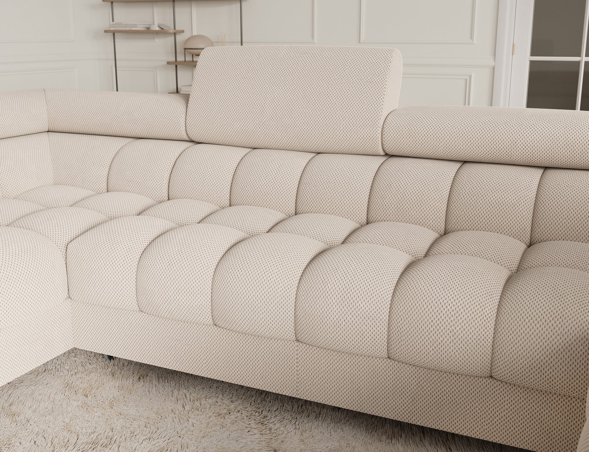 Środkowa część narożnika Fectory Calmora 18 beżowy z pikowanym siedziskiem i zagłówkiem, widok z bliska.