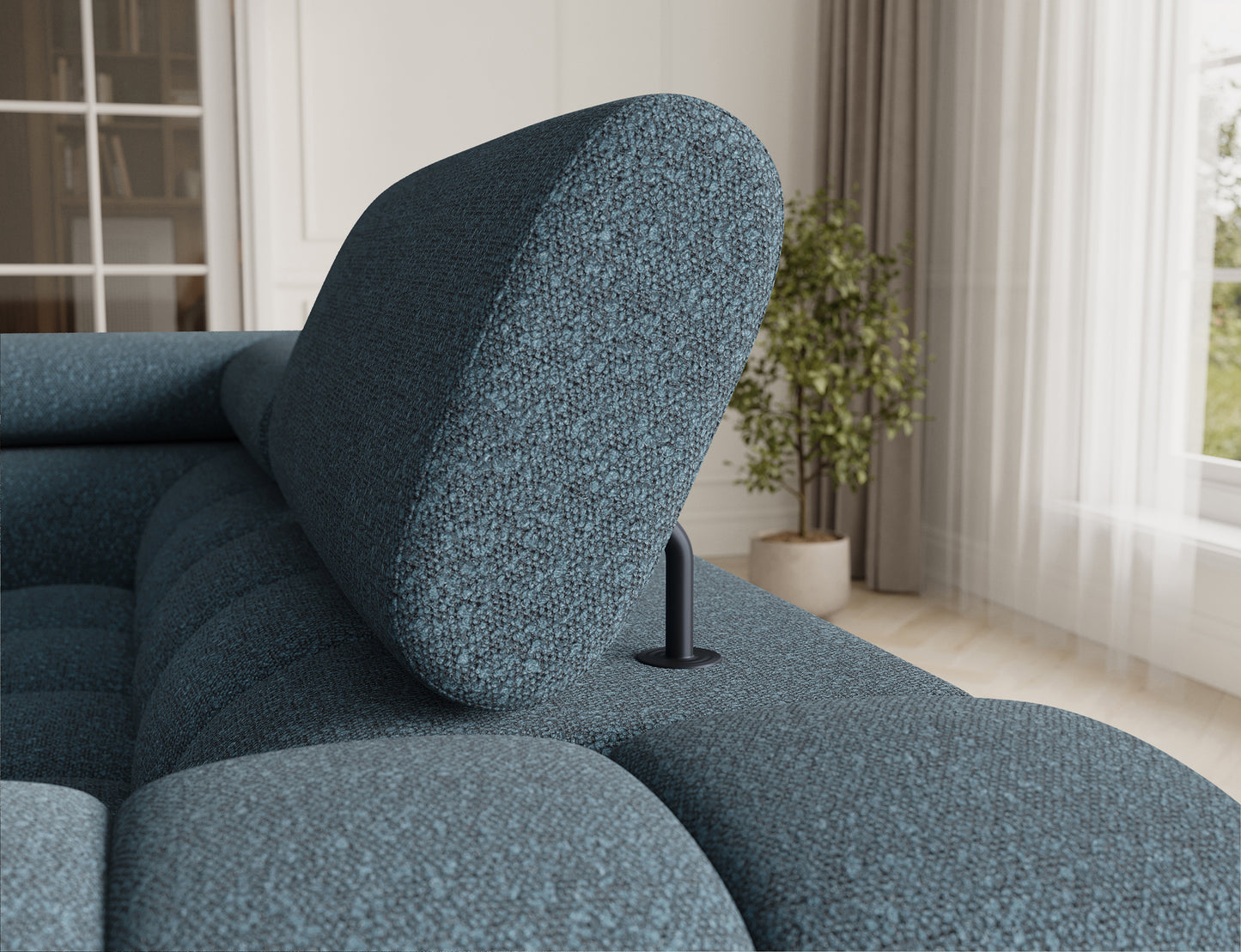 Zbliżenie na zagłówek narożnika Fectory w odcieniu niebieskim, z regulowaną częścią, zapewniającą wygodę użytkowania.