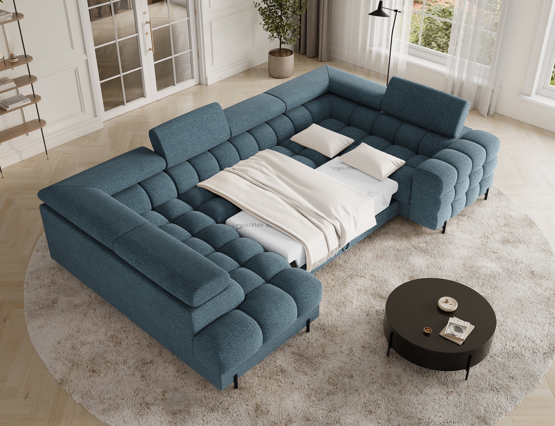 Narożnik Fectory w niebieskim kolorze z funkcją spania, z rozłożoną częścią, która zapewnia komfortową przestrzeń do wypoczynku.