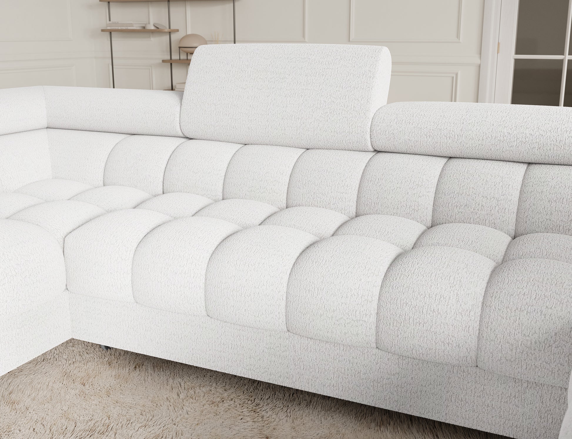 Zbliżenie na narożnik Fectory w białym kolorze, ukazujące doskonałą jakość materiału i elegancki wygląd. Idealny wybór do stylowych wnętrz.