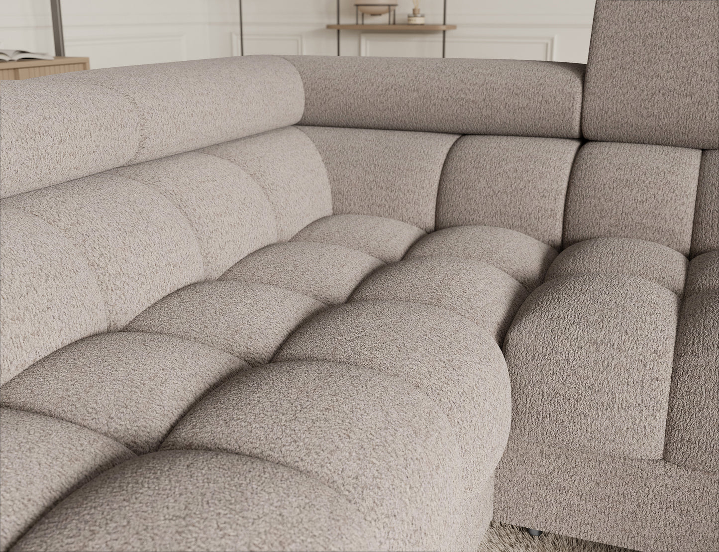 Sofa narożna Fectory w jasnobeżowym kolorze, z miękkim siedziskiem i nowoczesnym wykończeniem, zapewniająca komfort.