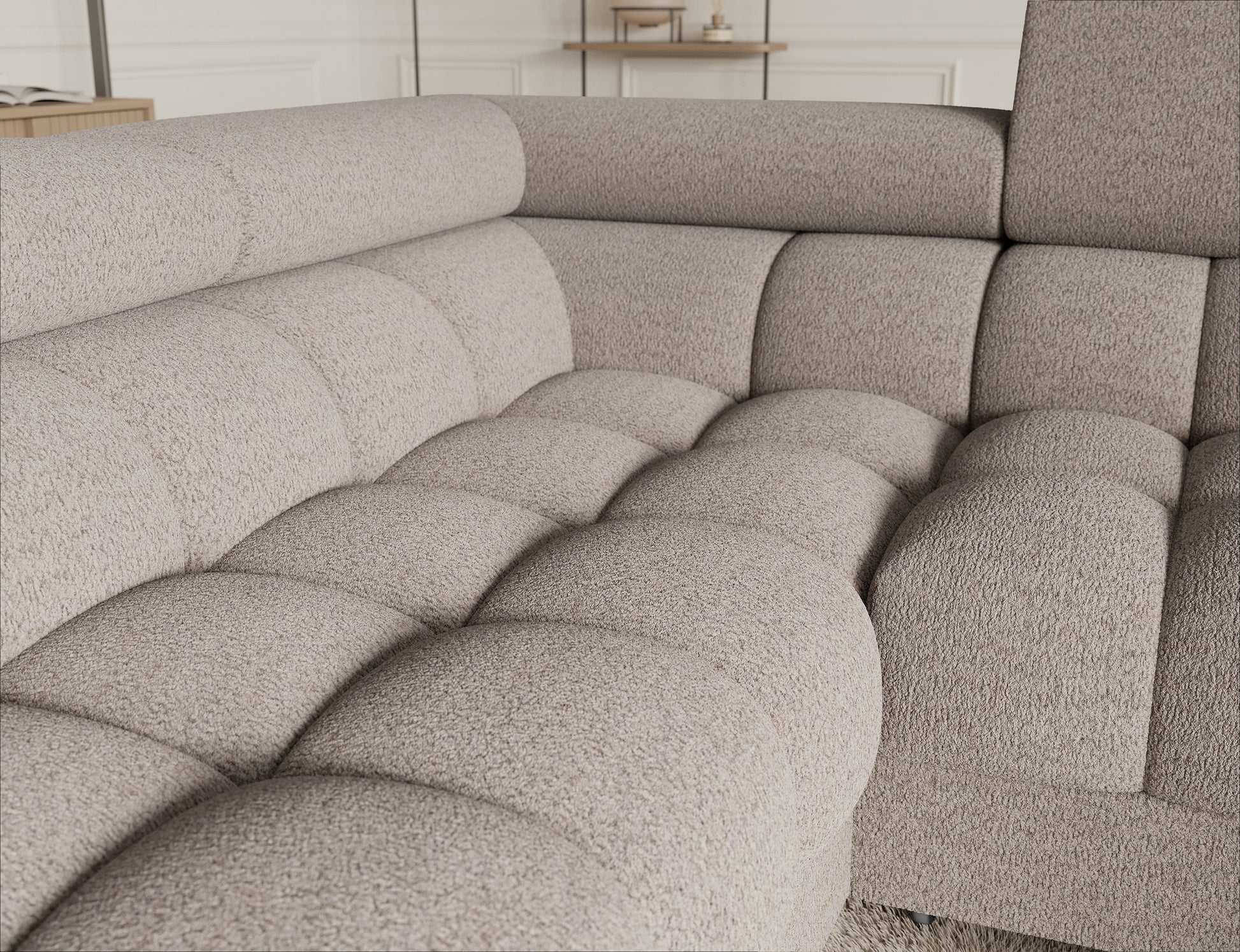 Sofa narożna Fectory w jasnobeżowym kolorze, z miękkim siedziskiem i nowoczesnym wykończeniem, zapewniająca komfort.