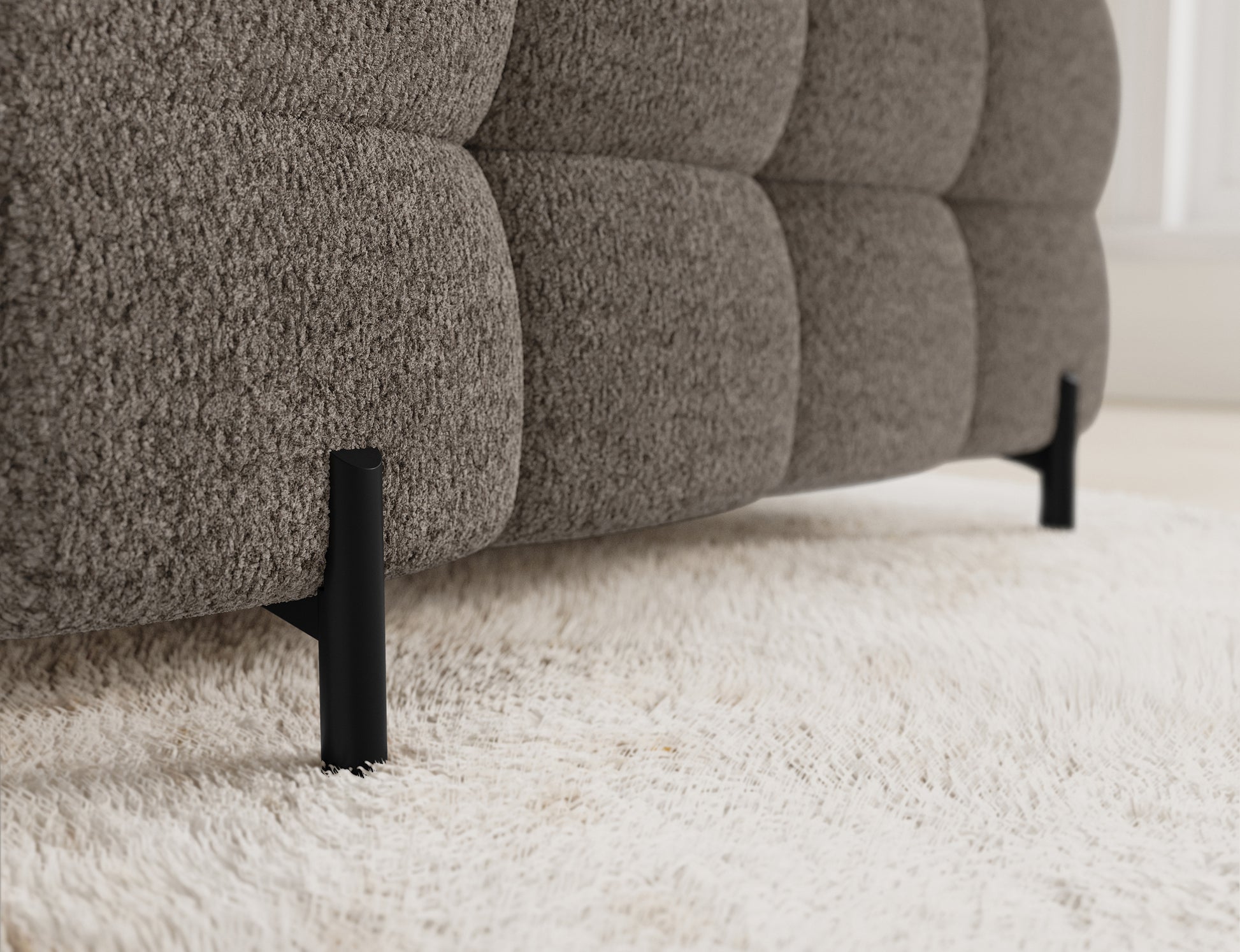 Narożnik Fectory w ciemnym beżu z regularnym pikowaniem, który stanowi elegancki element dekoracyjny w każdym wnętrzu.