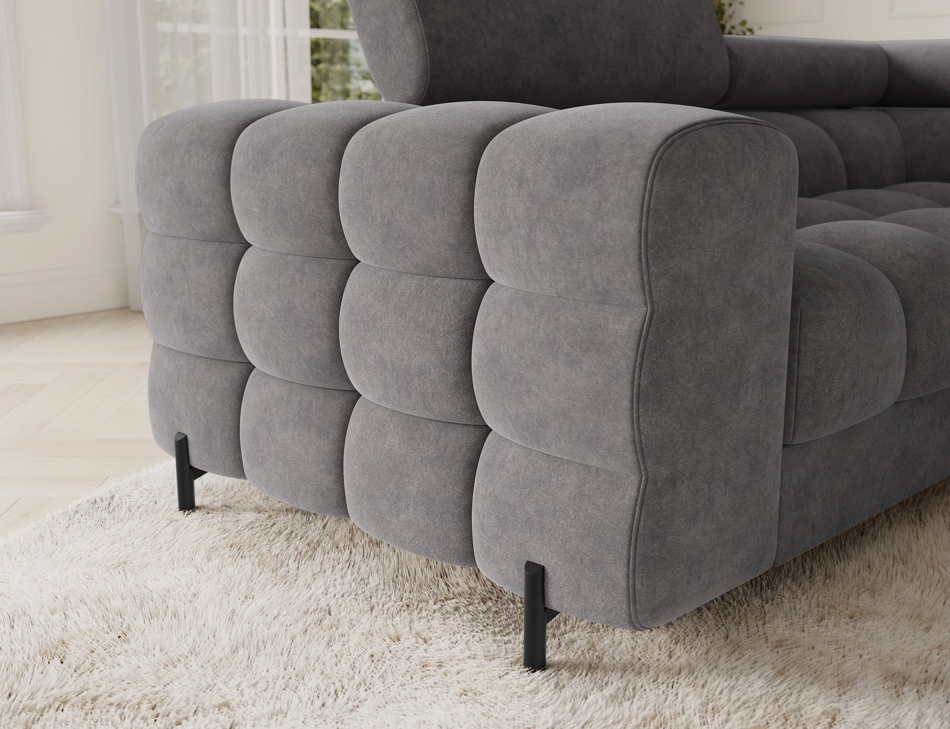 Detal narożnika Fectory w szarym kolorze z widoczną funkcją spania, ukazujący jego elegancki i praktyczny design.