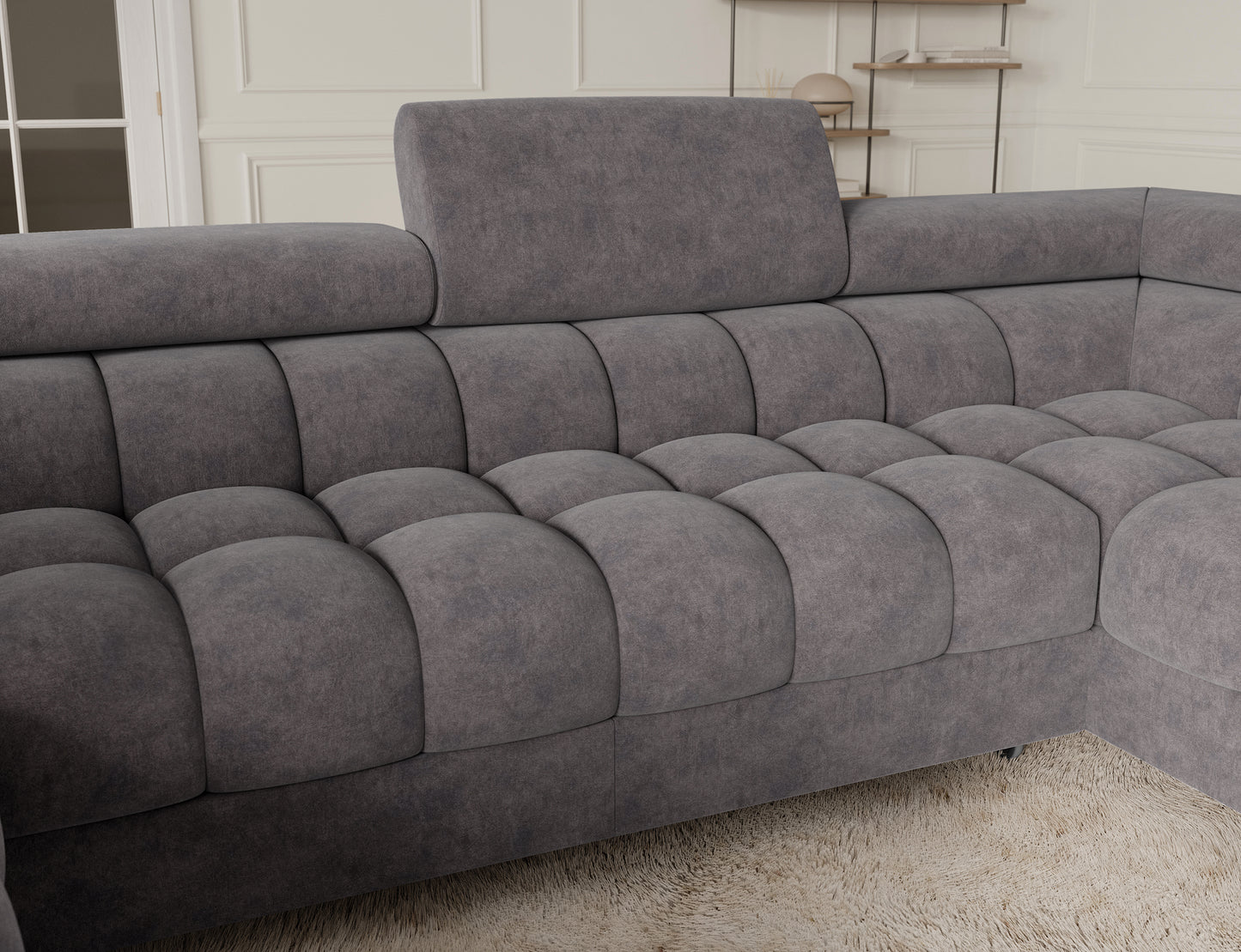 Detal narożnika Fectory w kolorze szarym z funkcją spania, idealny do nowoczesnych wnętrz, oferujący wygodę i oszczędność miejsca.