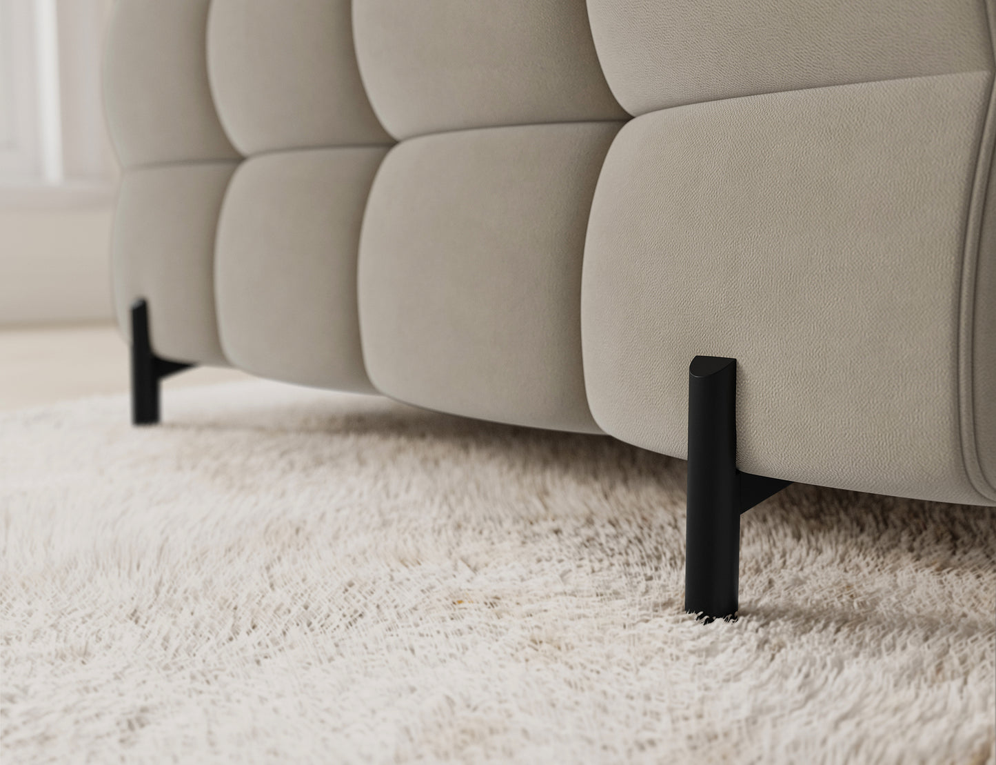 Narożnik Fectory prawy Aura 18 kremowy – szczegół nogi; czarna, smukła metalowa noga, nowoczesny design i stabilność