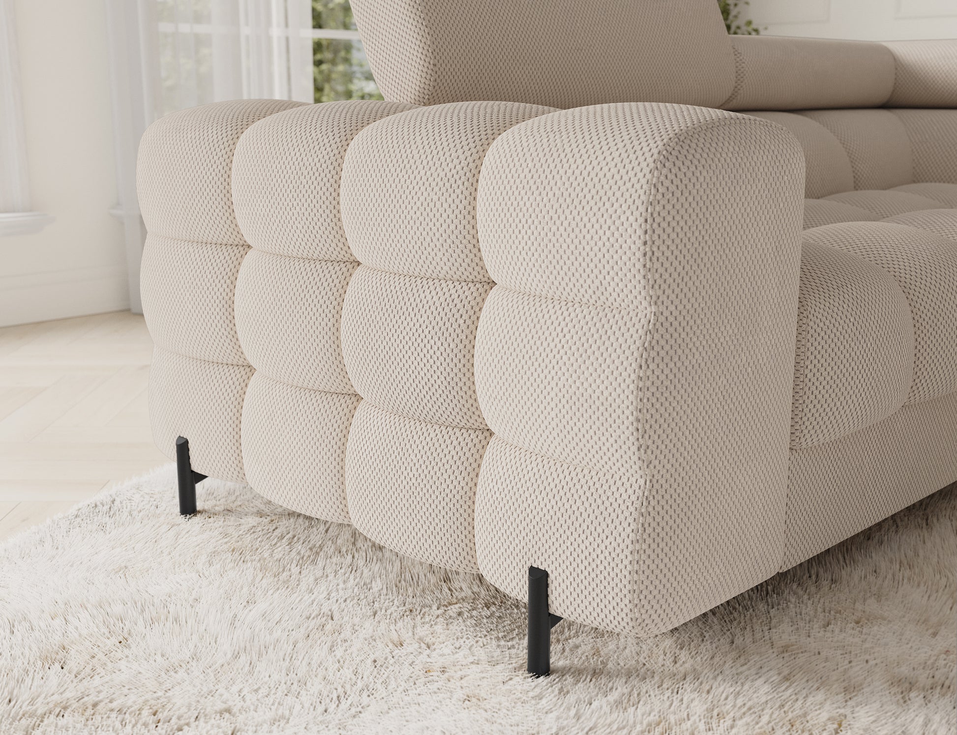 Bok narożnika Fectory Calmora 18 beżowy – pikowana forma, wyrazista faktura i czarne metalowe nogi.