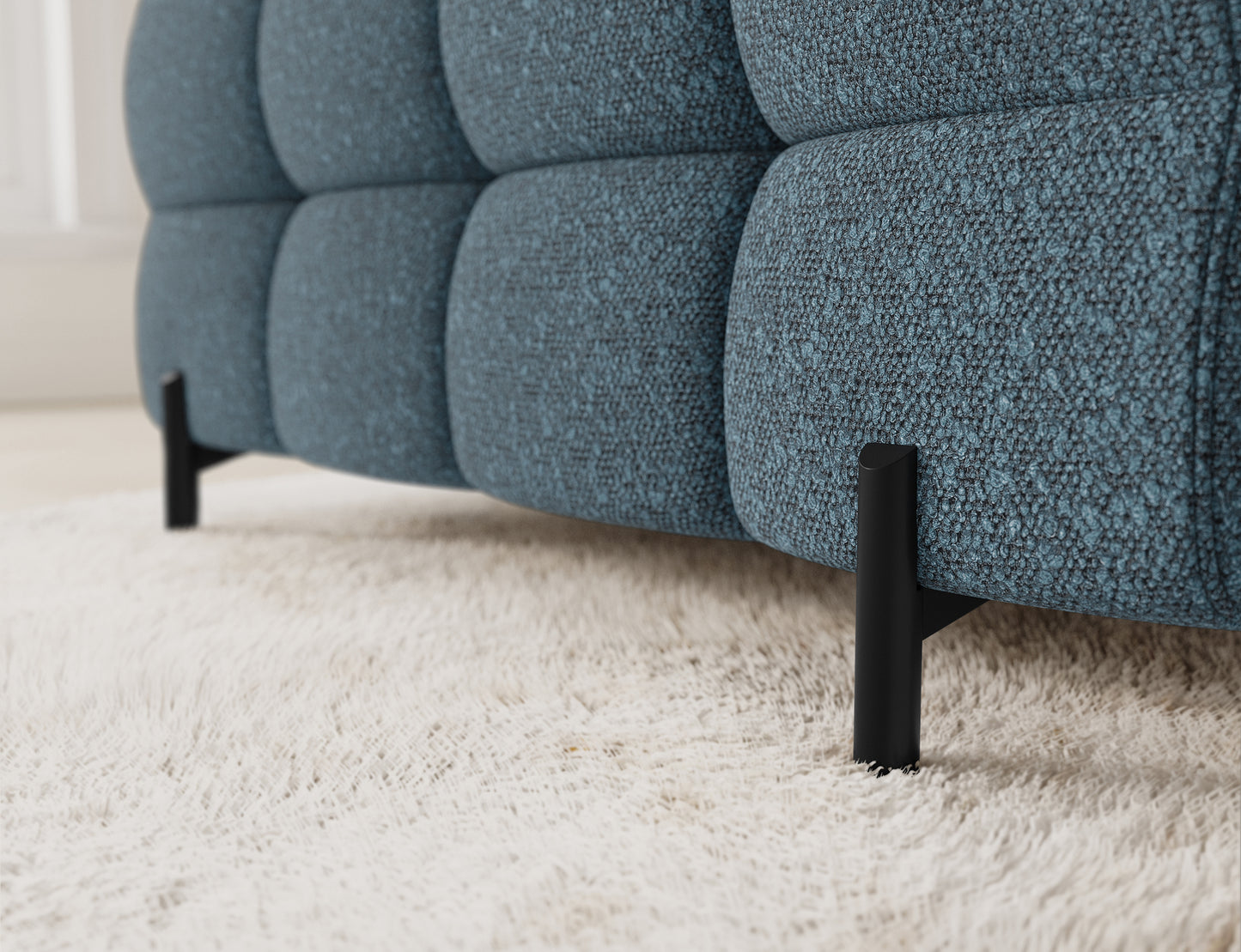 Zbliżenie na narożnik Fectory w niebieskim kolorze, ukazujące detale tapicerki, z wyraźnymi przeszyciami i nowoczesnym stylem.