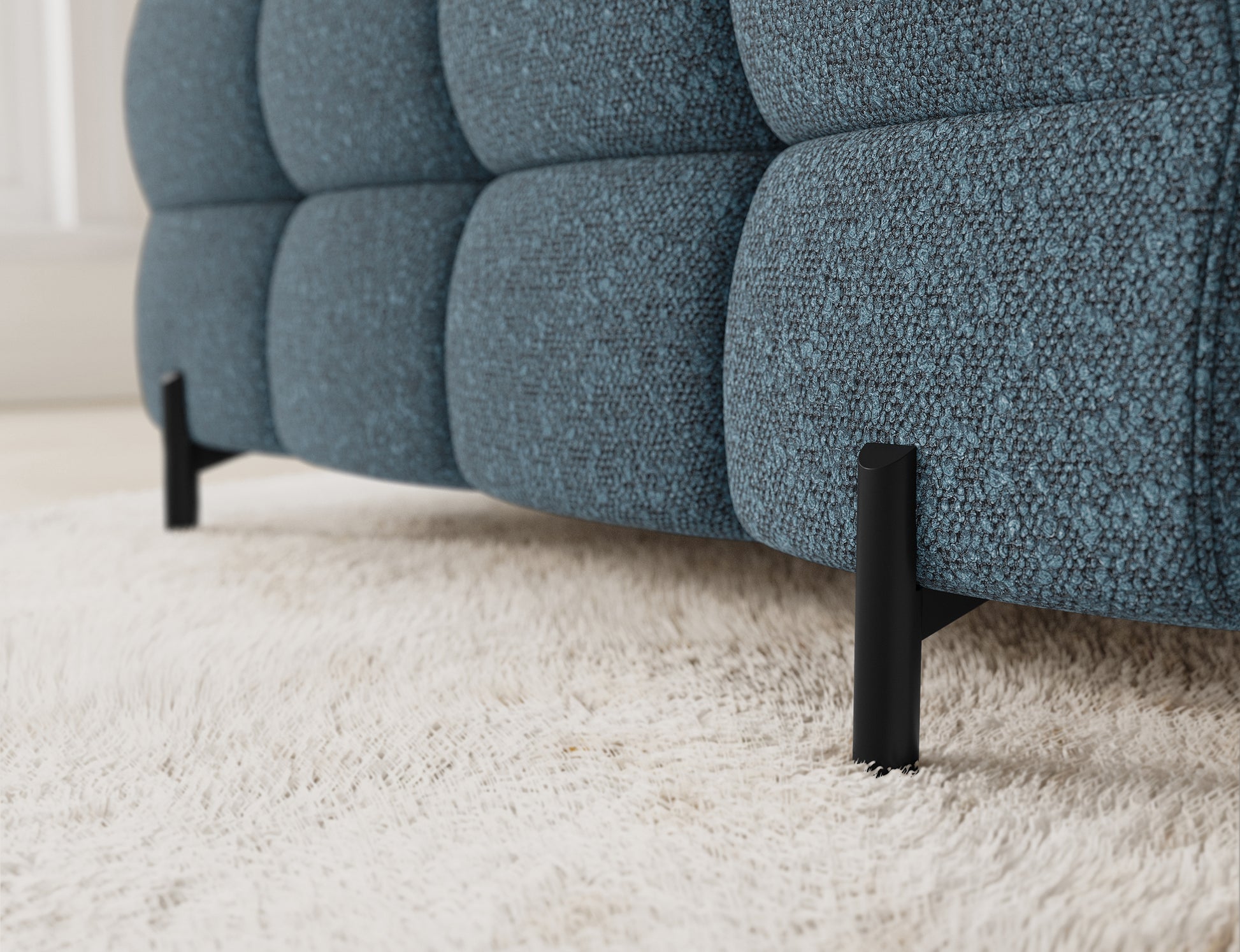 Zbliżenie na narożnik Fectory w niebieskim kolorze, ukazujące detale tapicerki, z wyraźnymi przeszyciami i nowoczesnym stylem.