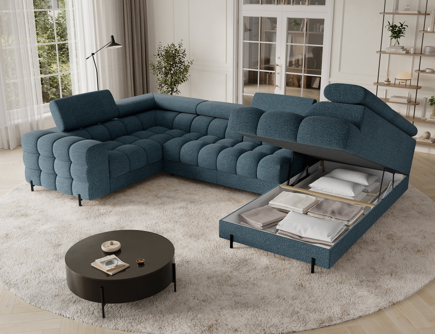 Narożnik Fectory w niebieskim odcieniu z pojemnikiem na pościel, doskonały do przechowywania i utrzymania porządku w salonie.