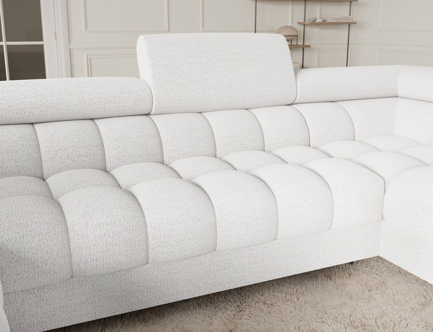 Zbliżenie na narożnik Fectory, detal w kolorze białym, ukazujący komfortowe siedzisko i elegancką tapicerkę z delikatnym wzorem.