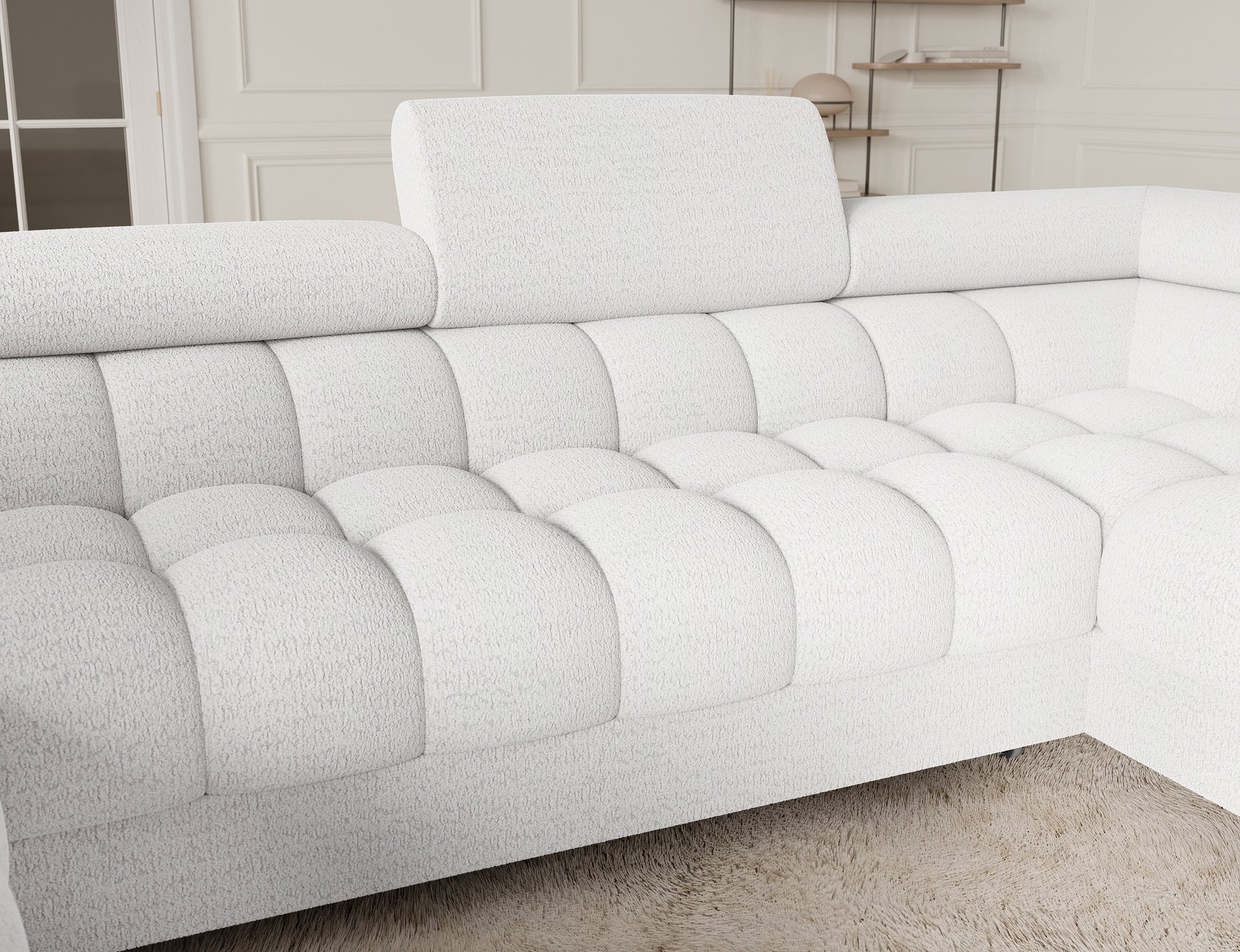 Zbliżenie na narożnik Fectory, detal w kolorze białym, ukazujący komfortowe siedzisko i elegancką tapicerkę z delikatnym wzorem.