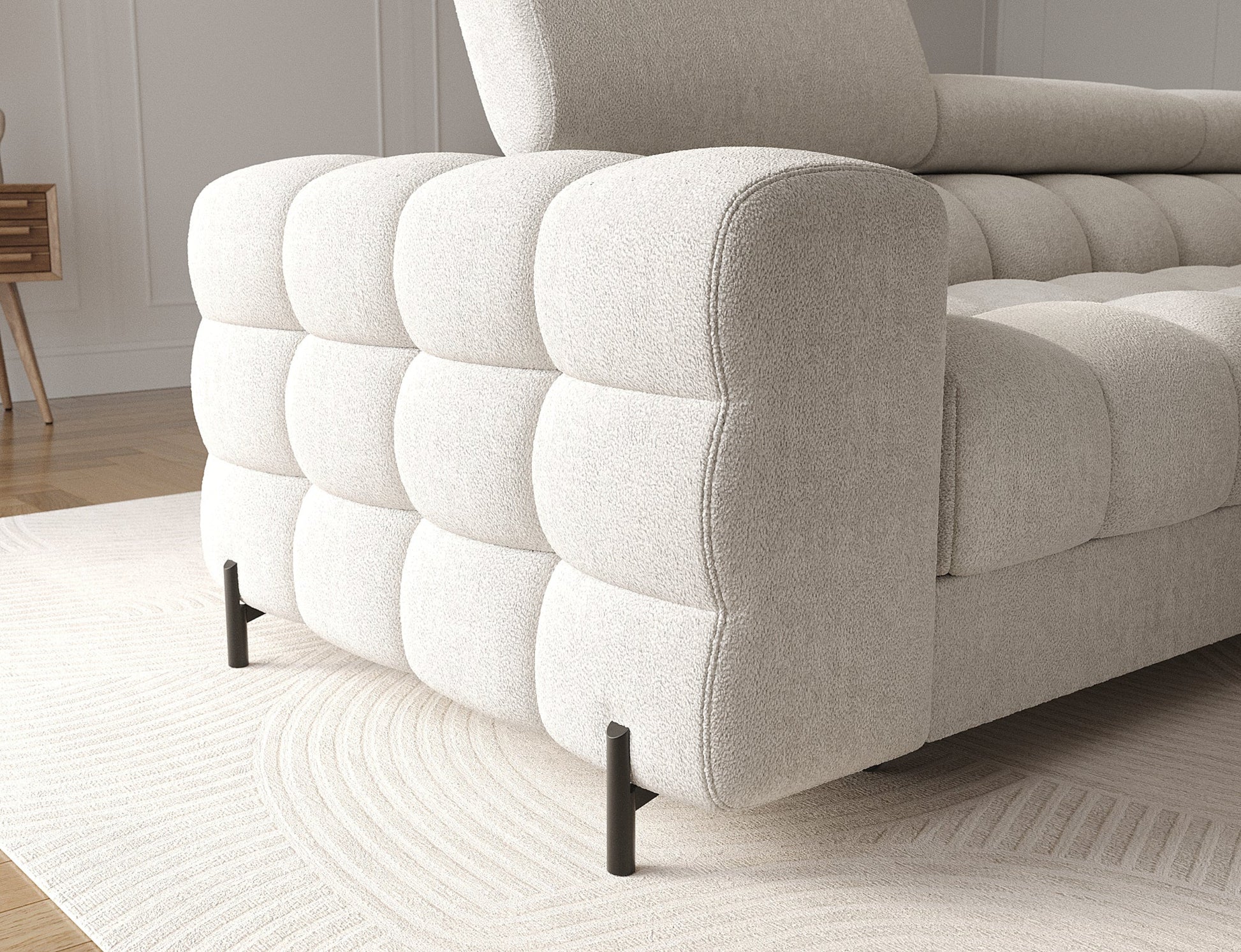 Zbliżenie na narożnik Ferlo z regulowanym zagłówkiem. Elegancki design, funkcja spania typu Delfin i pojemnik na pościel.