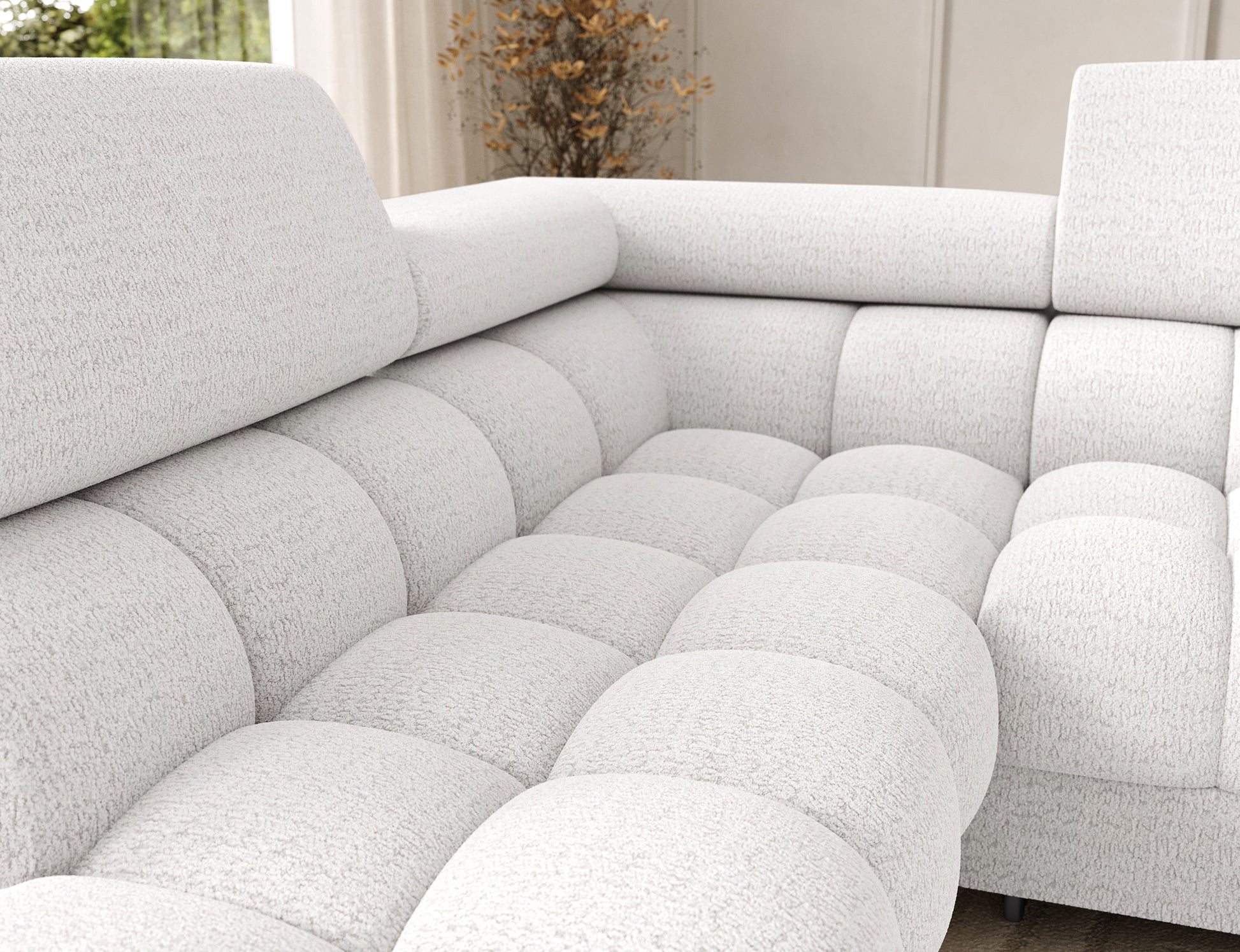 Oparcie narożnika Feraria lewy w tkaninie Royal 01 biały – głębokie pikowania i profilowane siedzisko zapewniające wygodę wypoczynku.