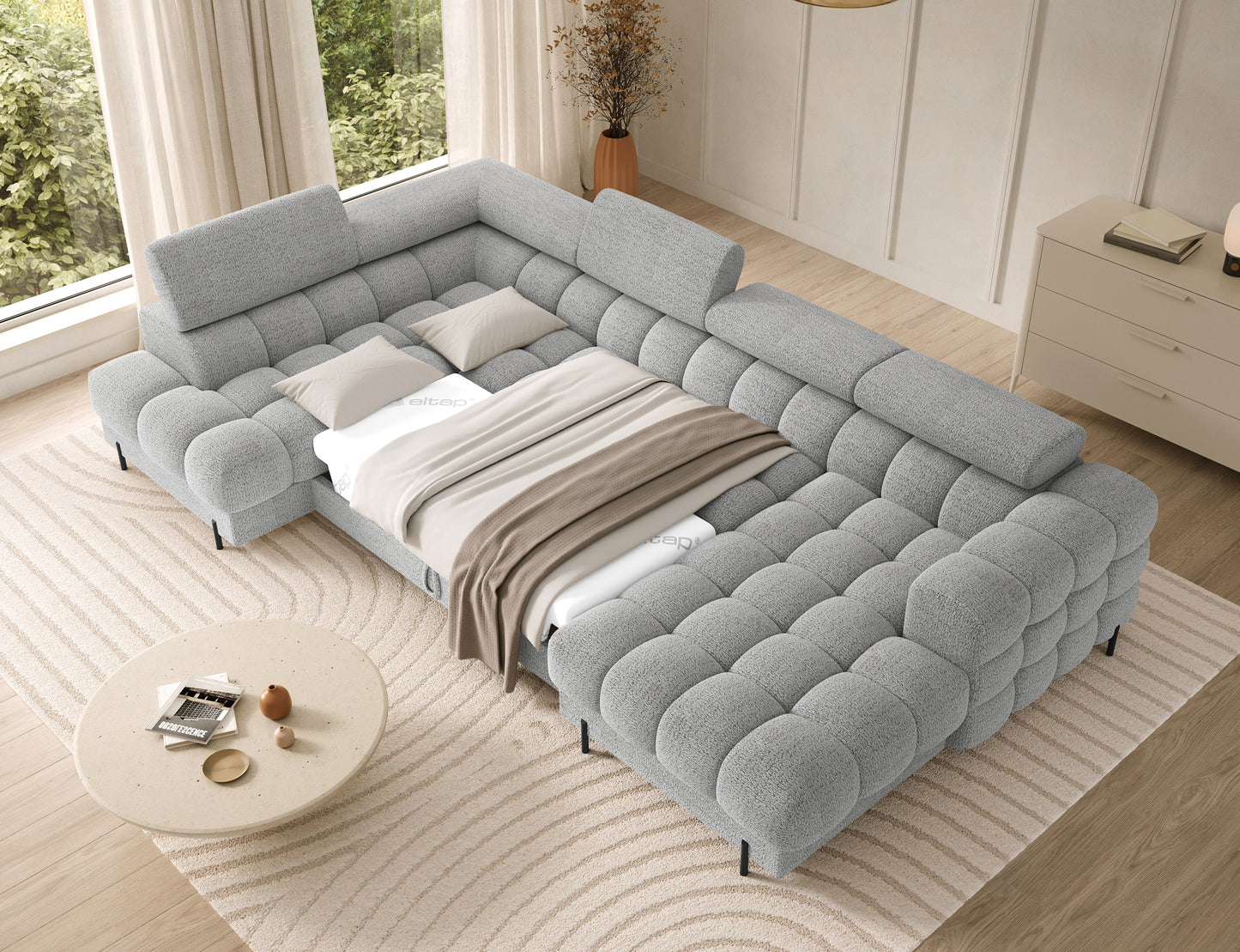 Narożnik Feraria lewy w tkaninie Royal 03 jasnoszary rozłożony do spania – wygodna funkcja spania i obszerna powierzchnia użytkowa.