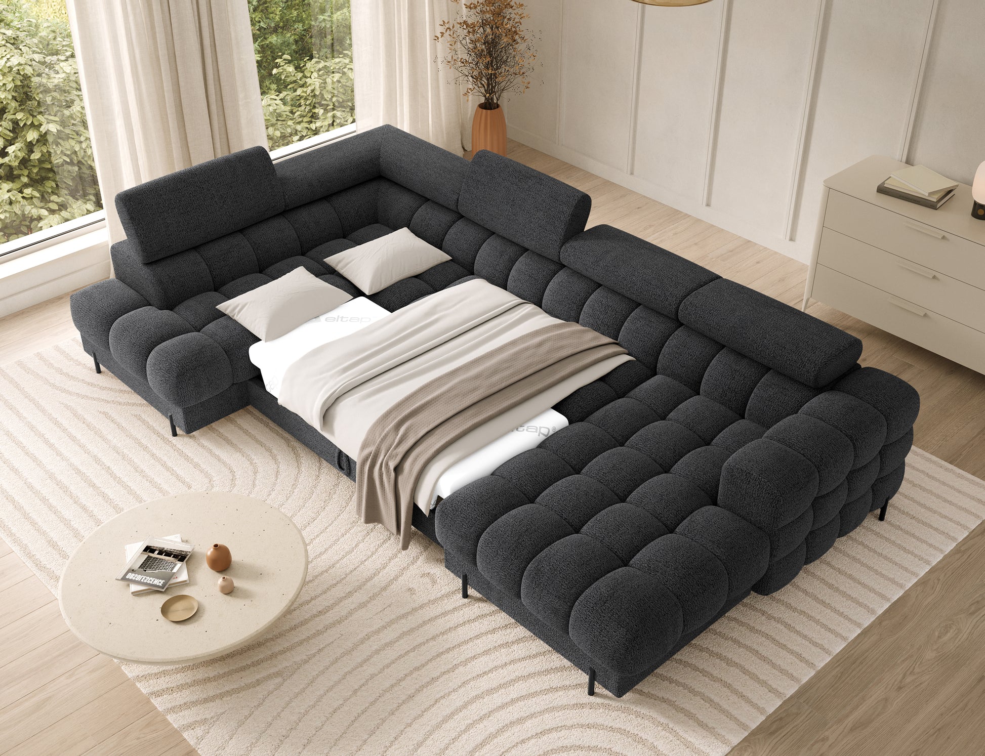 Narożnik Feraria lewy w tkaninie Royal 05 ciemnoszary rozłożony do spania – obszerna funkcja spania zapewniająca komfortowy wypoczynek.