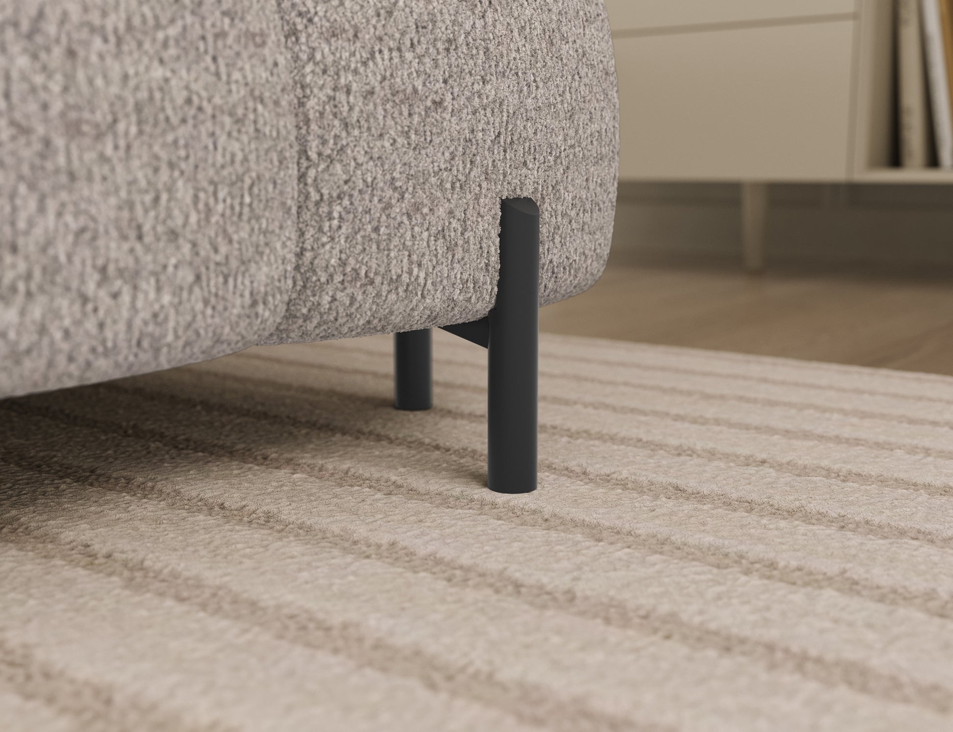 Detal czarnej metalowej nogi narożnika Feraria prawy w tkaninie Royal 18 jasnobeżowy – stabilność i elegancja w nowoczesnym stylu.