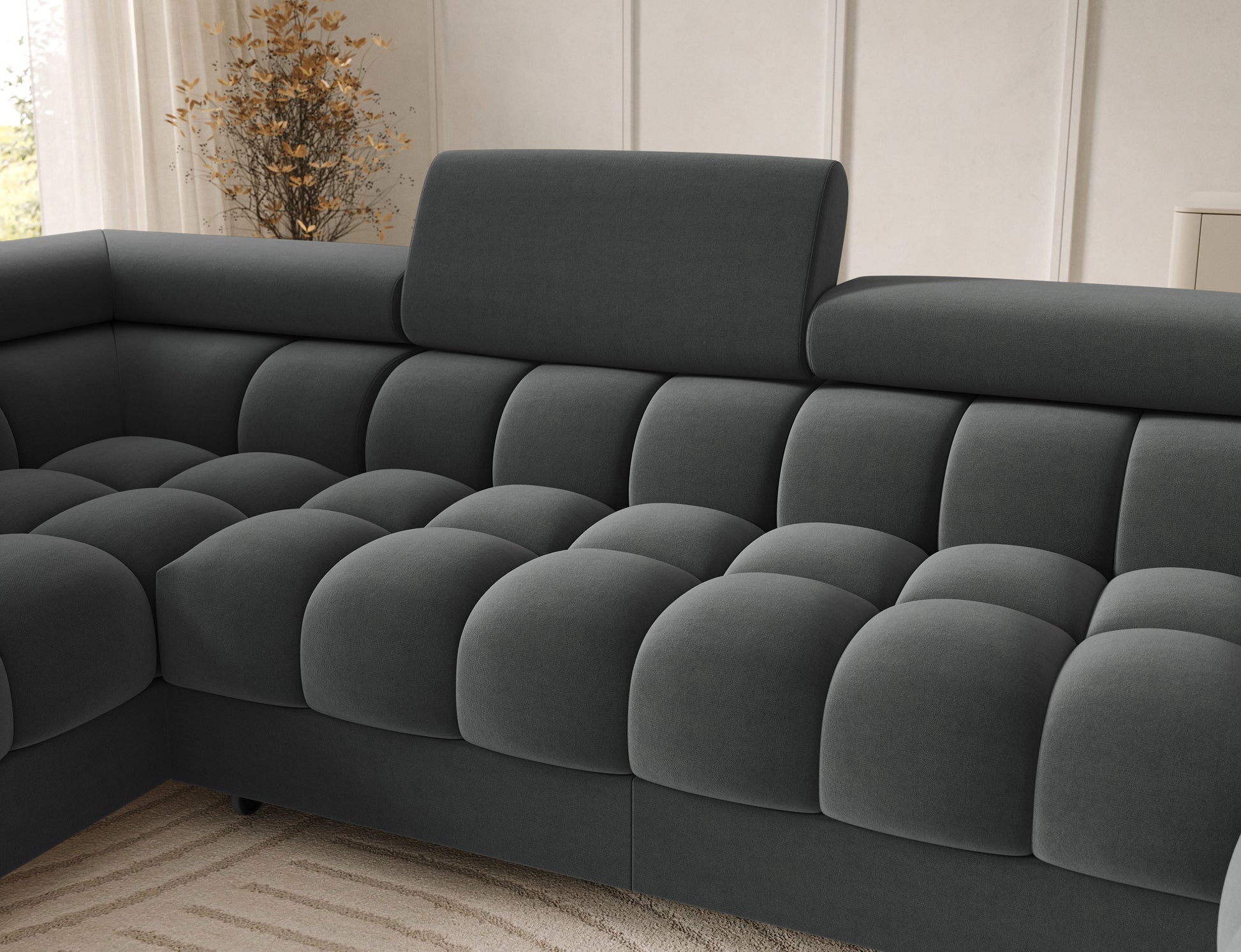 Metalowa noga narożnika Feraria lewy w kolorze czarnym. Stabilna podstawa łączy się z nowoczesnym designem mebla.