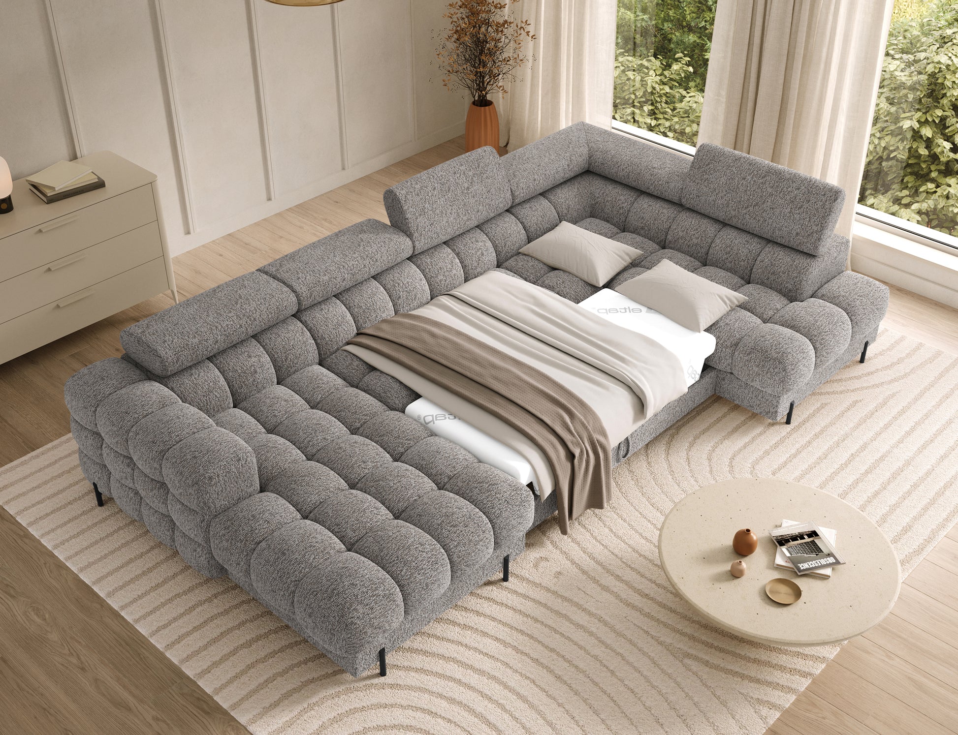 Narożnik Feraria prawy w tkaninie Pellerito 20 ciemnobeżowy rozłożony do spania – duża powierzchnia i wygodna funkcja spania.