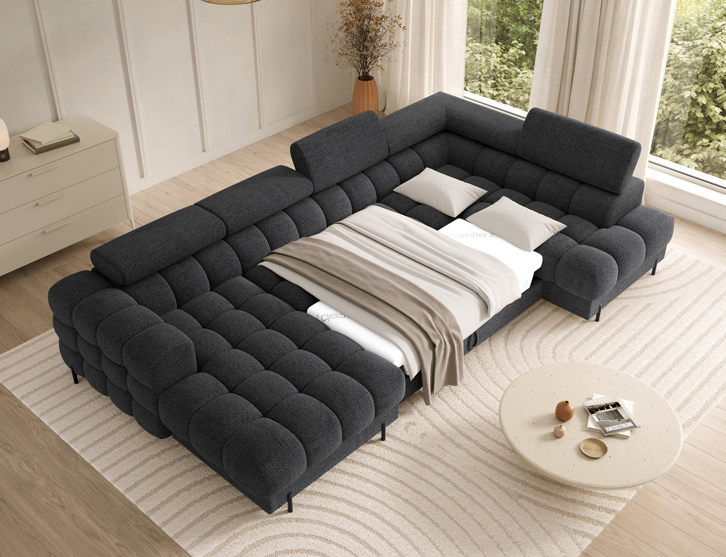 Narożnik Feraria prawy w tkaninie Royal 05 ciemnoszary rozłożony do spania – funkcja spania z dużą, komfortową powierzchnią.