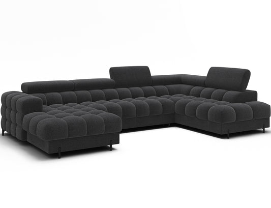 Narożnik Feraria prawy w tkaninie Royal 05 ciemnoszary – nowoczesny układ U-Form widoczny pod skosem w jasnej aranżacji salonu.