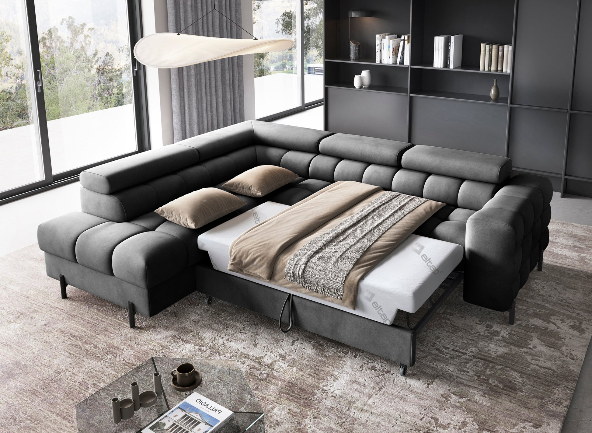 Narożnik Ferucce z funkcją spania – rozłożona powierzchnia spania prezentująca wnętrze z materacem i pościelą, tapicerka w kolorze ciemnoszarym Paros 06.