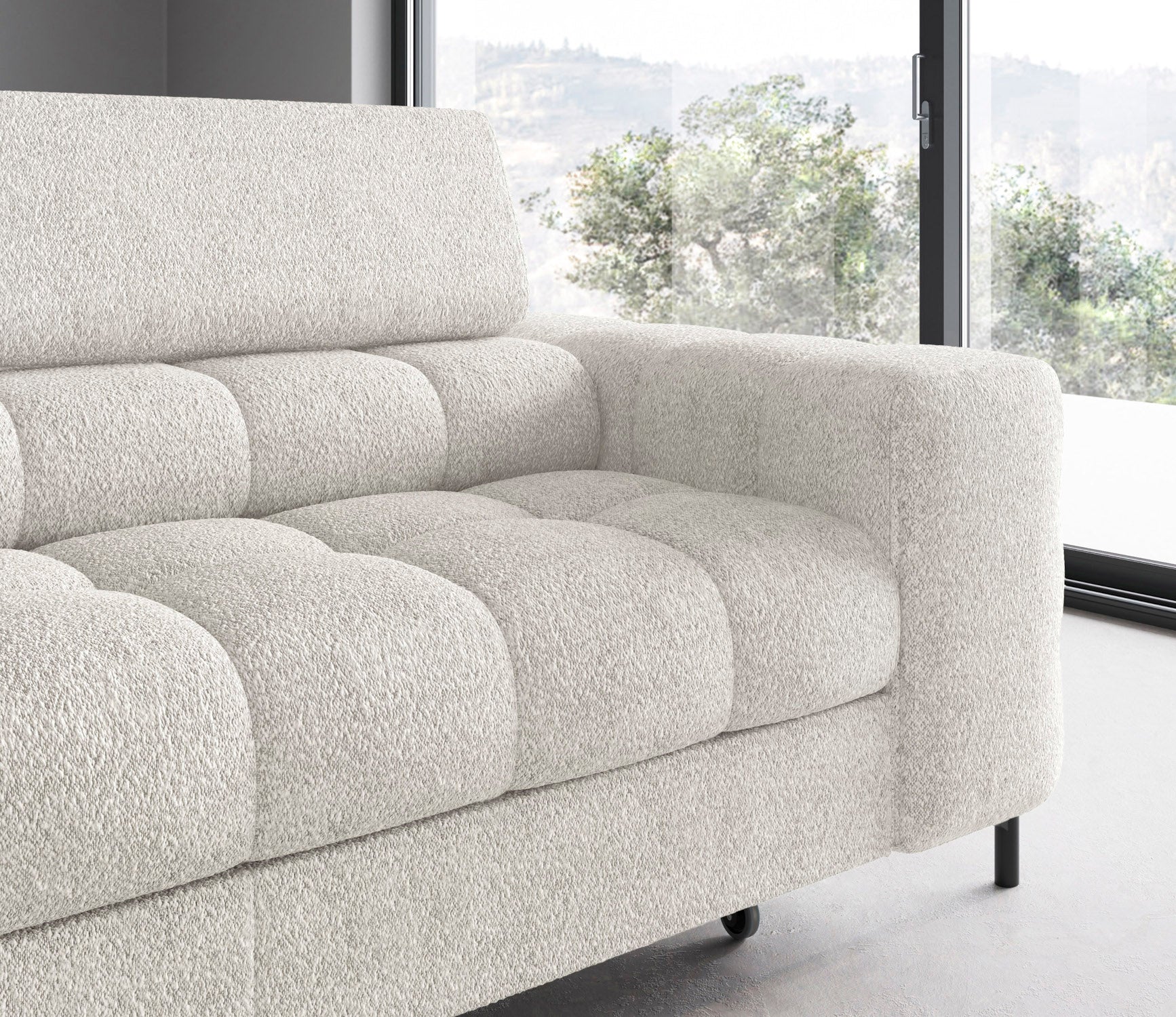 Zbliżenie na podłokietnik i siedzisko lewego ramienia narożnika Ferucce – miękkie linie i jednolita biała tapicerka Royal 01.