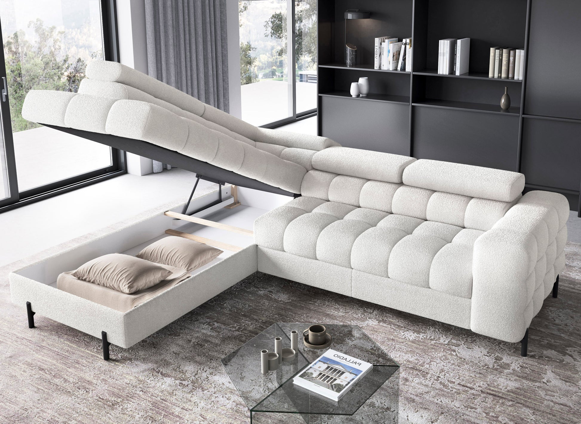 Narożnik Ferucce w białej tkaninie Royal 01 z otwartym pojemnikiem na pościel – mechanizm podnoszenia części siedziska ułatwiający przechowywanie.