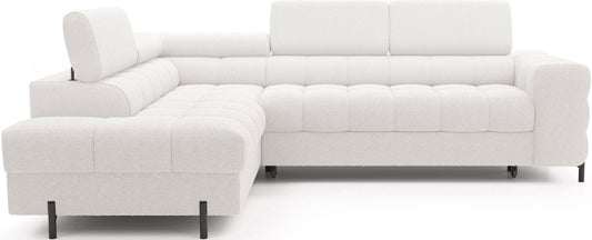 Narożnik Ferucce w tkaninie Royal 01 biały, widok z przodu na model w układzie lewym – elegancki i nowoczesny design z miękkimi poduszkami siedziskowymi i zagłówkami.